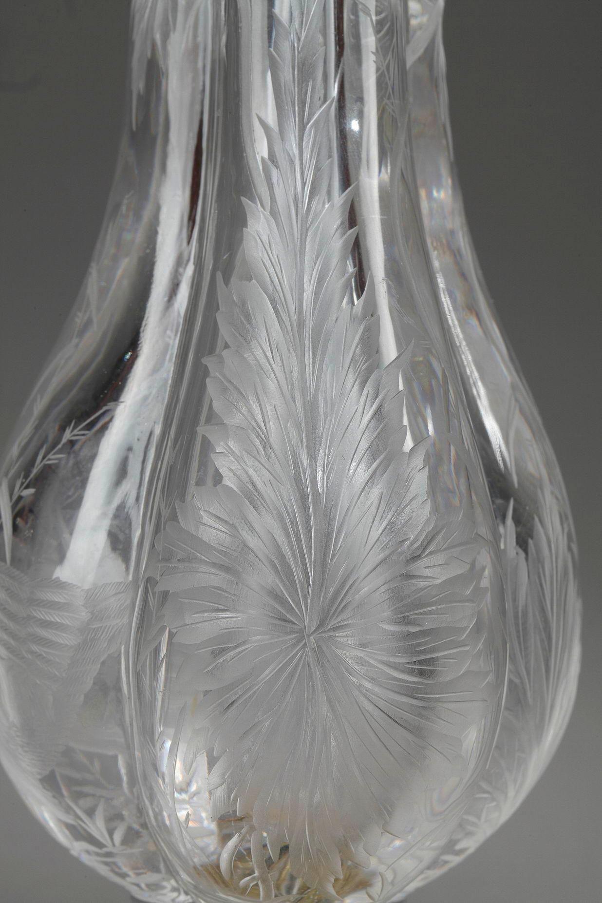 Swan Vase
by ESCALIER DE CRISTAL (19th century)

Vase of poly-lobed shape made in clear crystal
with a decor of swans, poppies and water plants
Decoration engraved with a wheel
Mounted on a 
