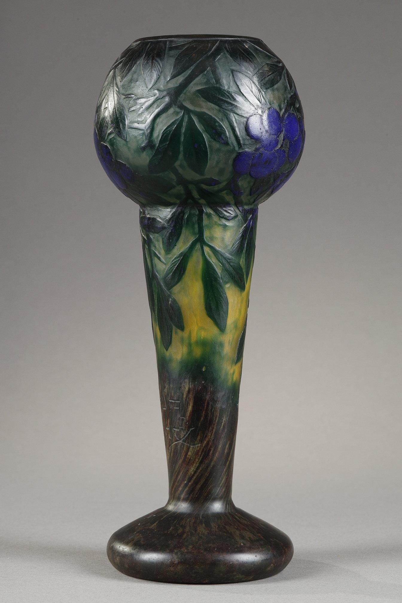 Vase with sloes
by DAUM

Vase with a sloe plaques decor
Multilayer blown-molded glass, colored by vitrification of powders
With an acid-etched decor in reserve for the leaves.
Decor of small plaques for the berries

Signed 