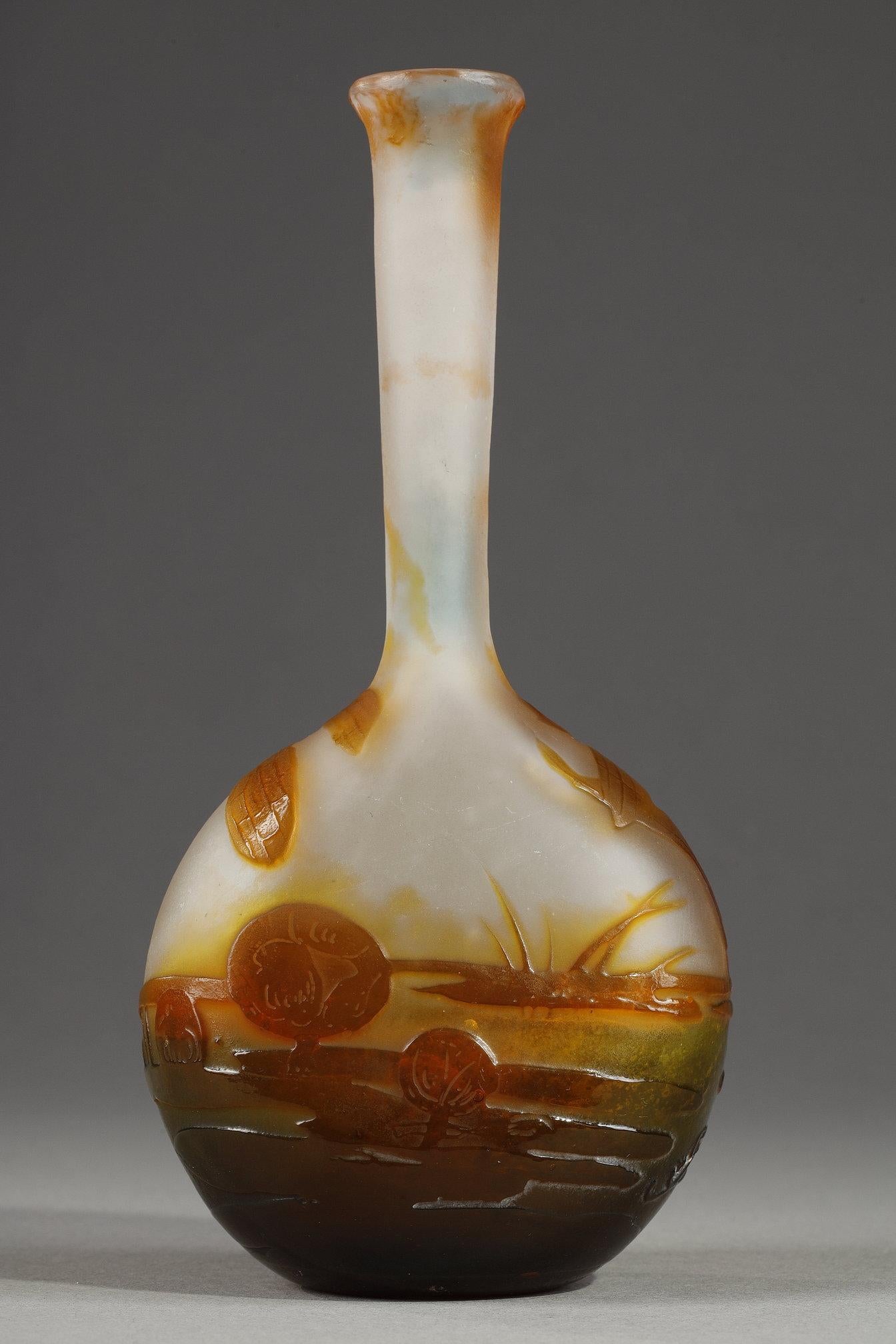 Vase with a Damselfly
by Etablissements GALLE
 
A bud vase with a flattened body
Multilayer glass
decorated with orange and green acid-etched water landscape with a Damselfly
on a white background

Signed 