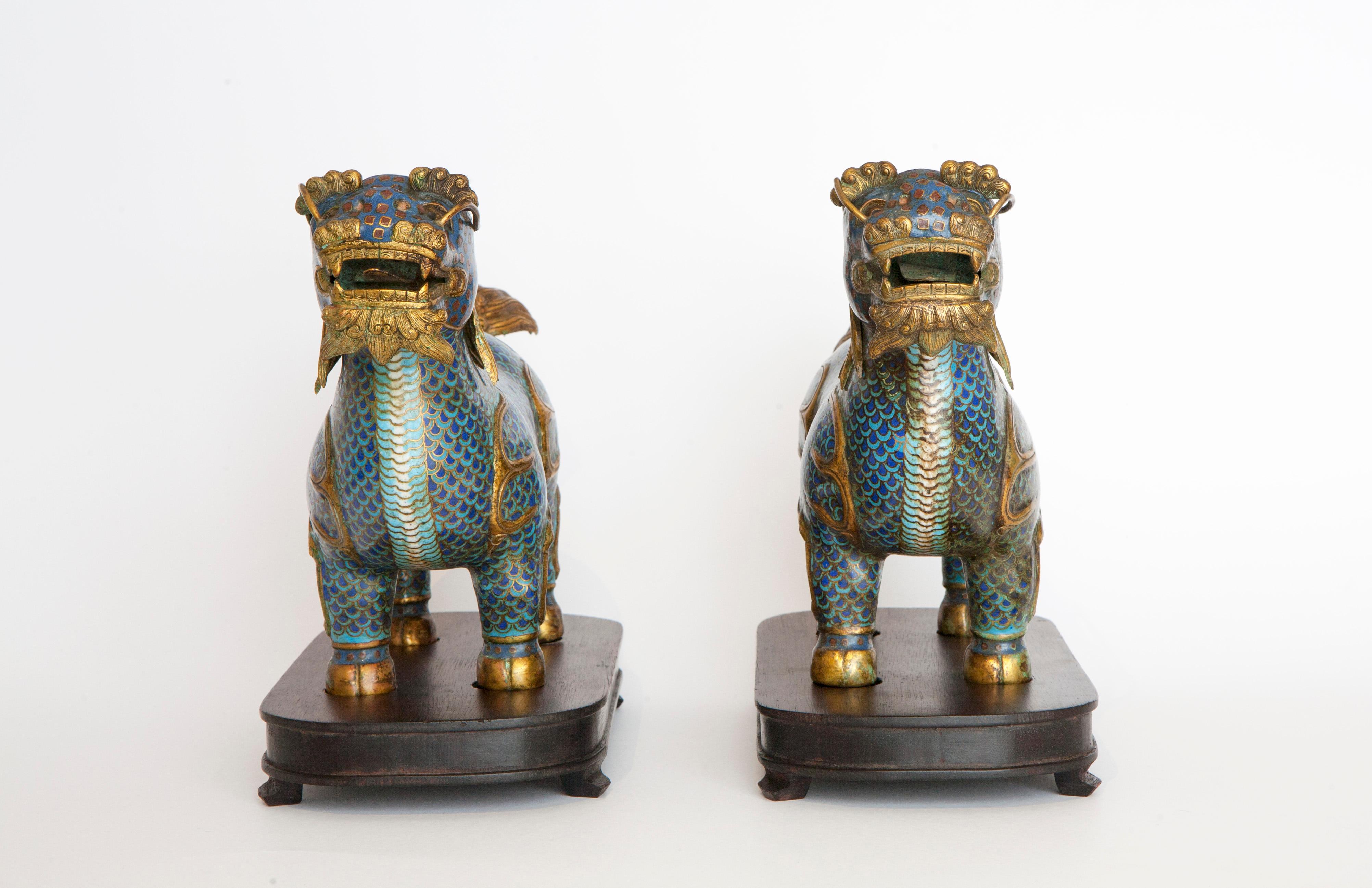 Pair of Qilin in cloisonné resting on wooden bases For Sale 1