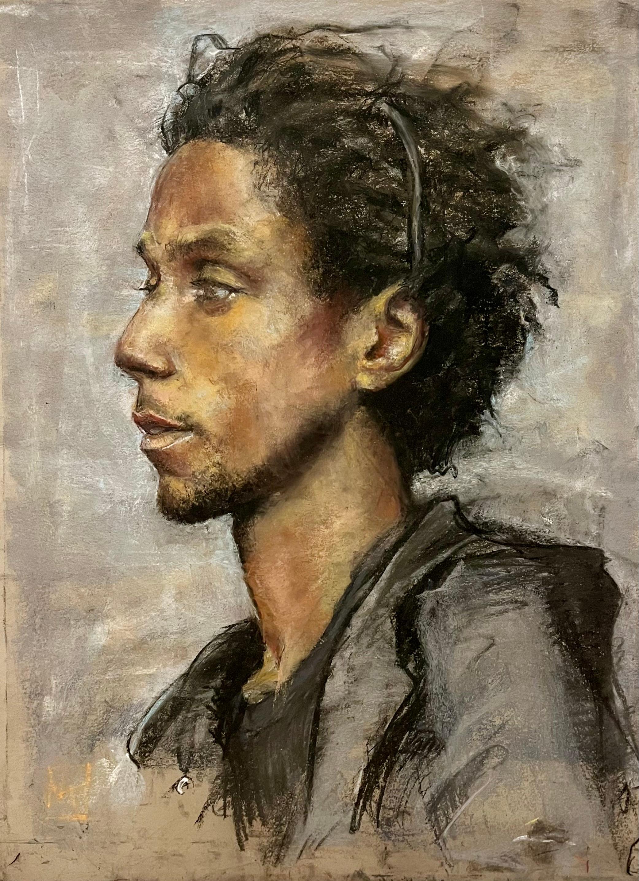 Side Profile of Young African American Man with Black Hoodie