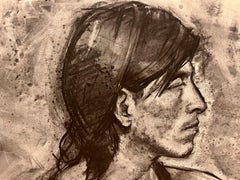 Retrato al carboncillo de hombre de pelo largo