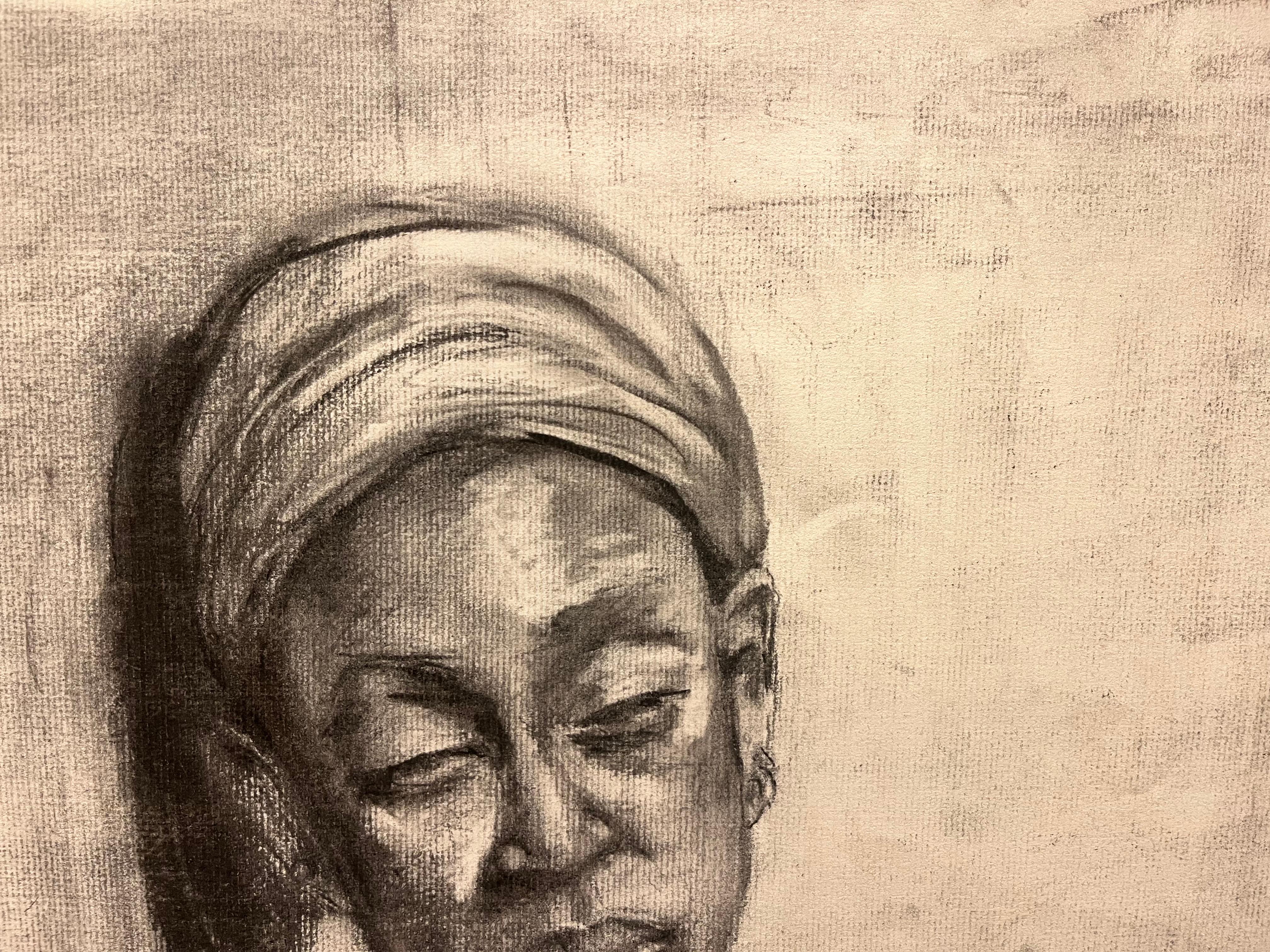 This captivating charcoal drawing depicts the upper half of a nude African American woman adorned with a wrapped headscarf. The contrast between the delicate curves of her bare shoulders and the intricate folds of the headscarf creates a striking