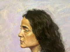 Side Profile of Woman with Dark Curly Hair