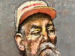 Retrato de hombre mayor con gorra de camionero