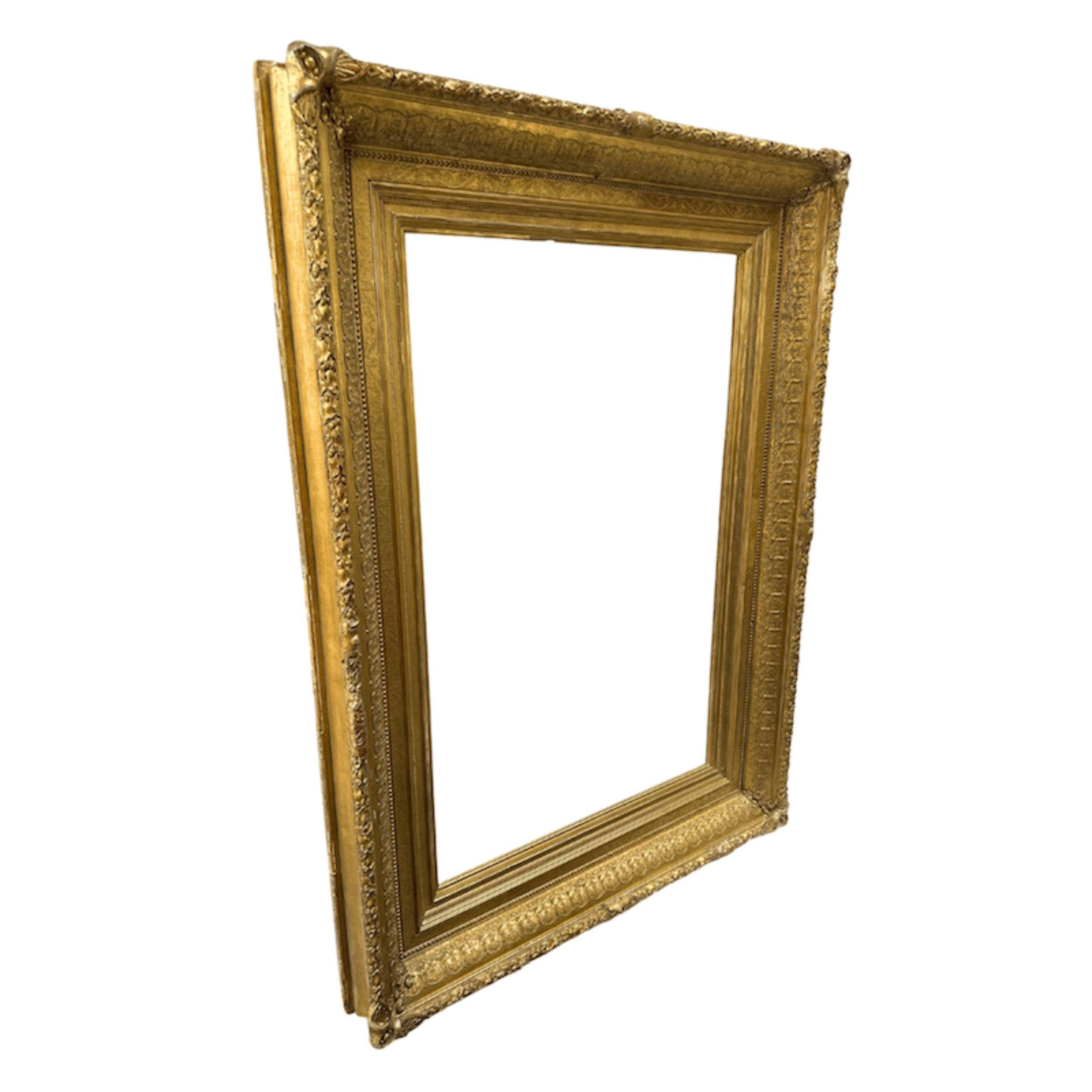 A Majestic Gilded Frame from 1880s America
With its radiant gold finish and bold proportions, this 1880s American frame embodies the grandeur of late 19th-century decorative arts. The luminous gilding, relatively untouched by patina, speaks to its