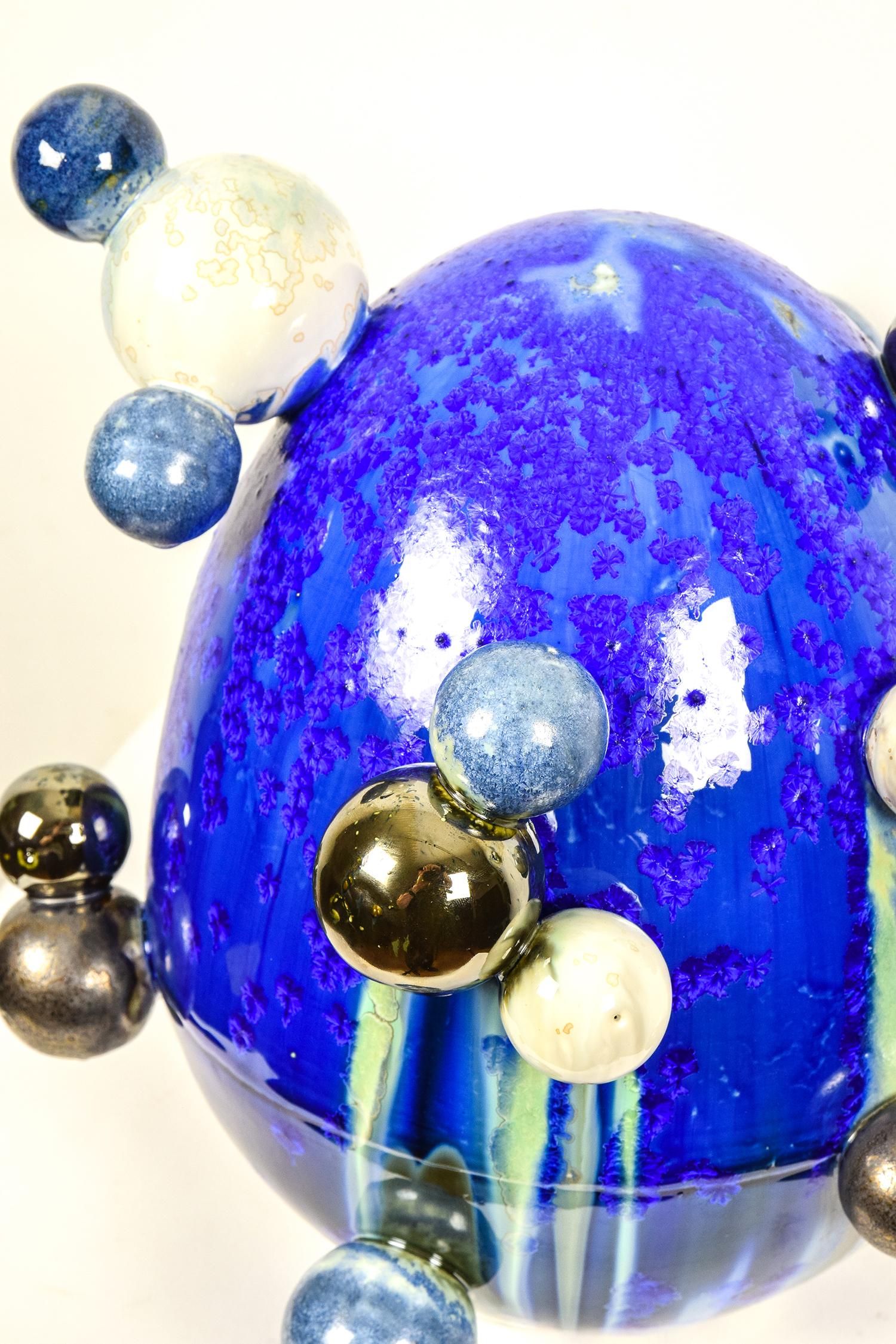 Atomic Egg by NAM TRAN (b. 1988)

Porcelain with crystalline glaze
32.4 x 32.7 x 27 cm (12 ³/₄ x 12 ⁷/₈ x 10 ⁵/₈ inches)
Initialled and numbered 1/1 on the base
Executed in 2019

Provenance
Studio of the Artist

This work is accompanied by a