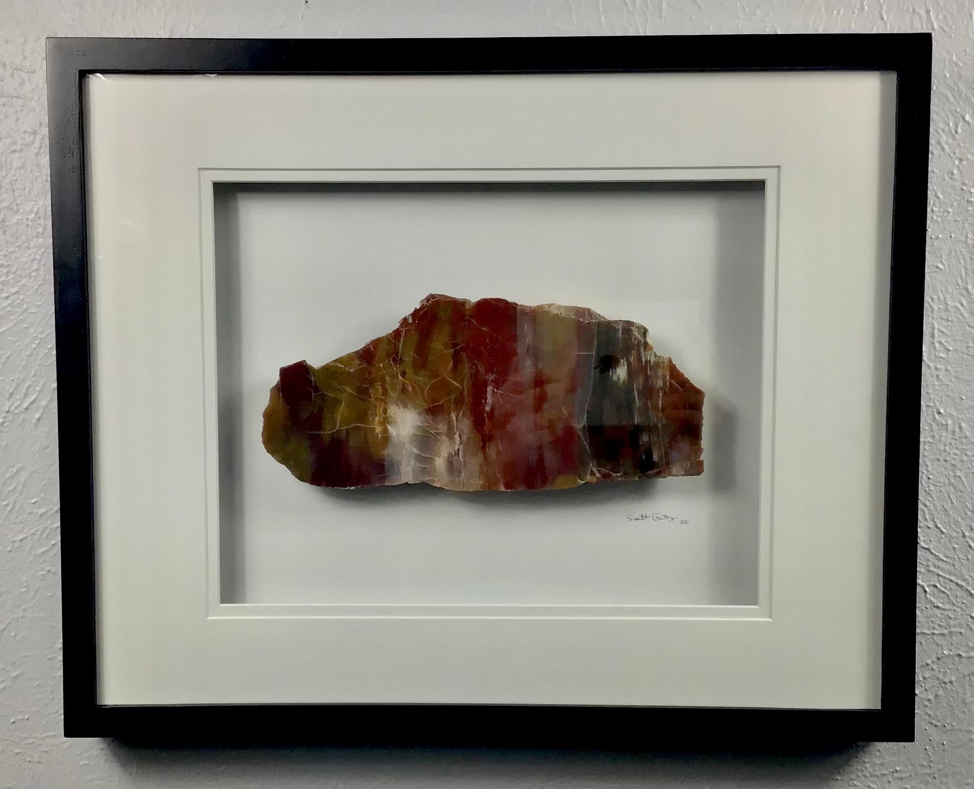 This 16x20 inch (17H x 21W x 1.375D inches framed) Arizona Rainbow Petrified Wood framed stone work of art has been created by Scott Gentry using real stones from his sculpture creation process. Each stone is lovingly and painstakingly hand-polished