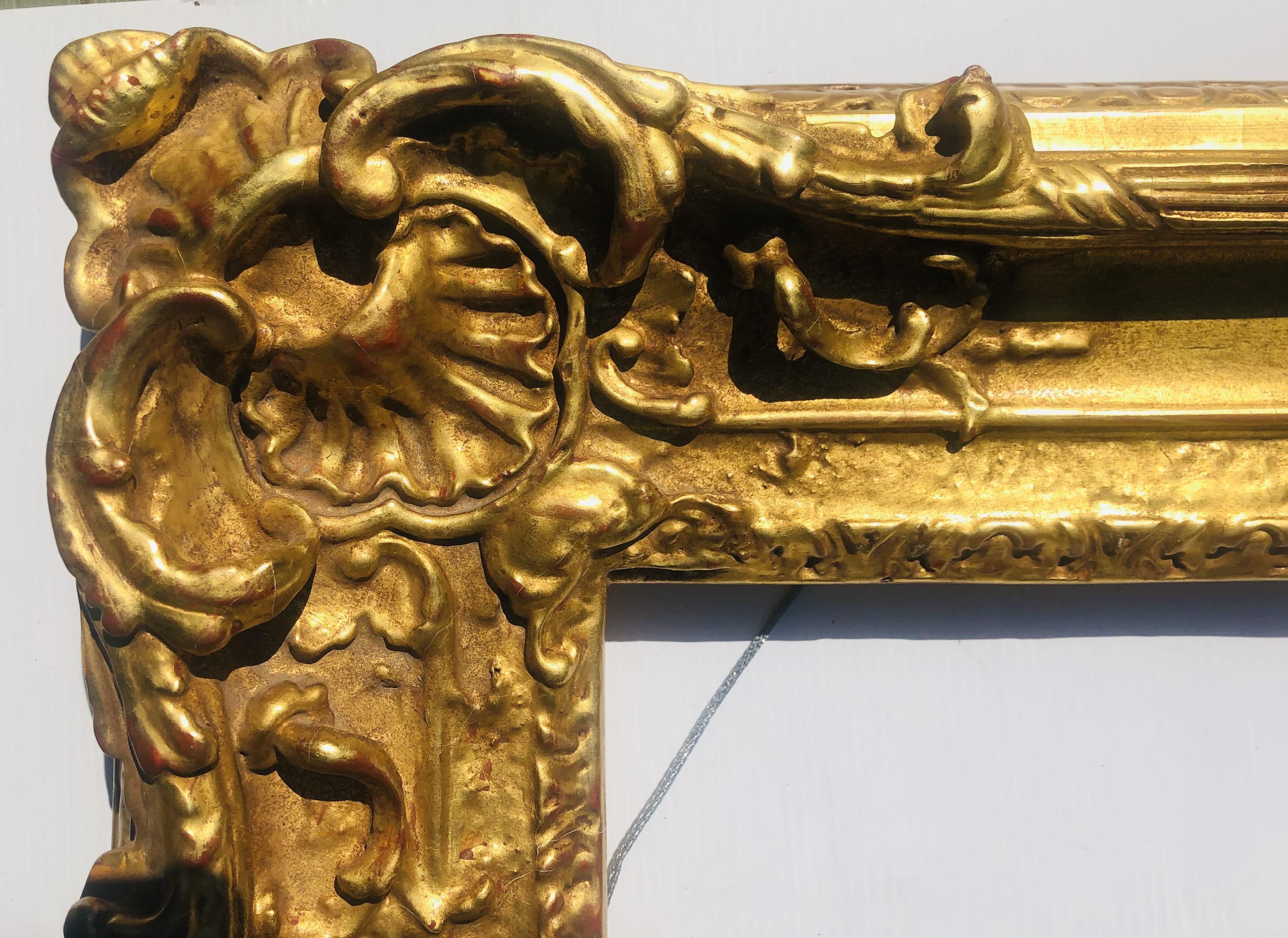 Gilded frame made in a traditional style. The frame opening will accommodate a painting or mirror that is 13 x 17 inches; with the addition of a 1