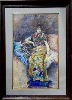 Woman in japonist dress seated on a sofa