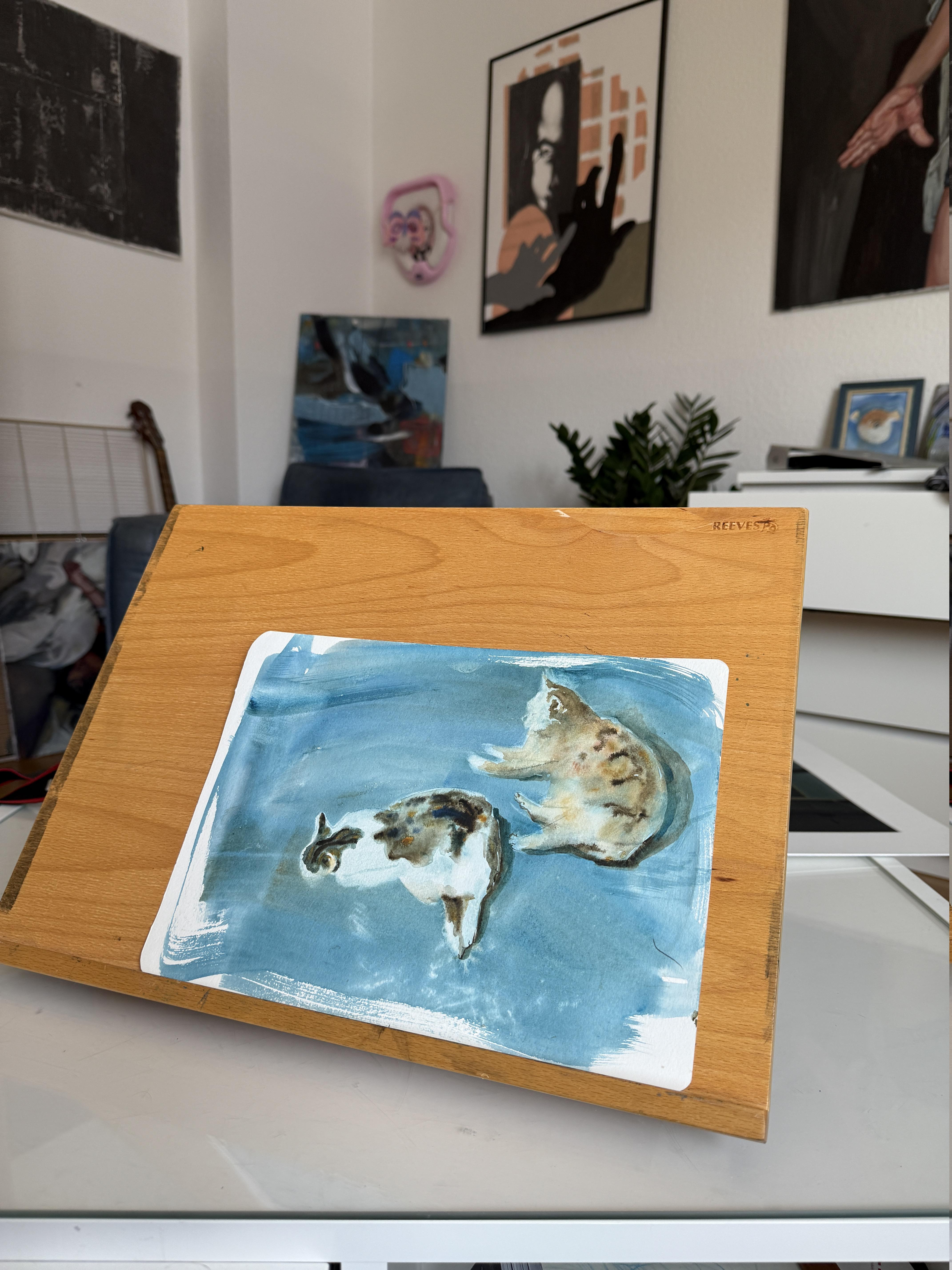 This bright, light watercolor is painted in one breath. Two cats are lying on a blue background, one of them is lazily squinting at the sun. The work is filled with sunlight and a feeling of summer. You can't help but want to stop, freeze and enjoy