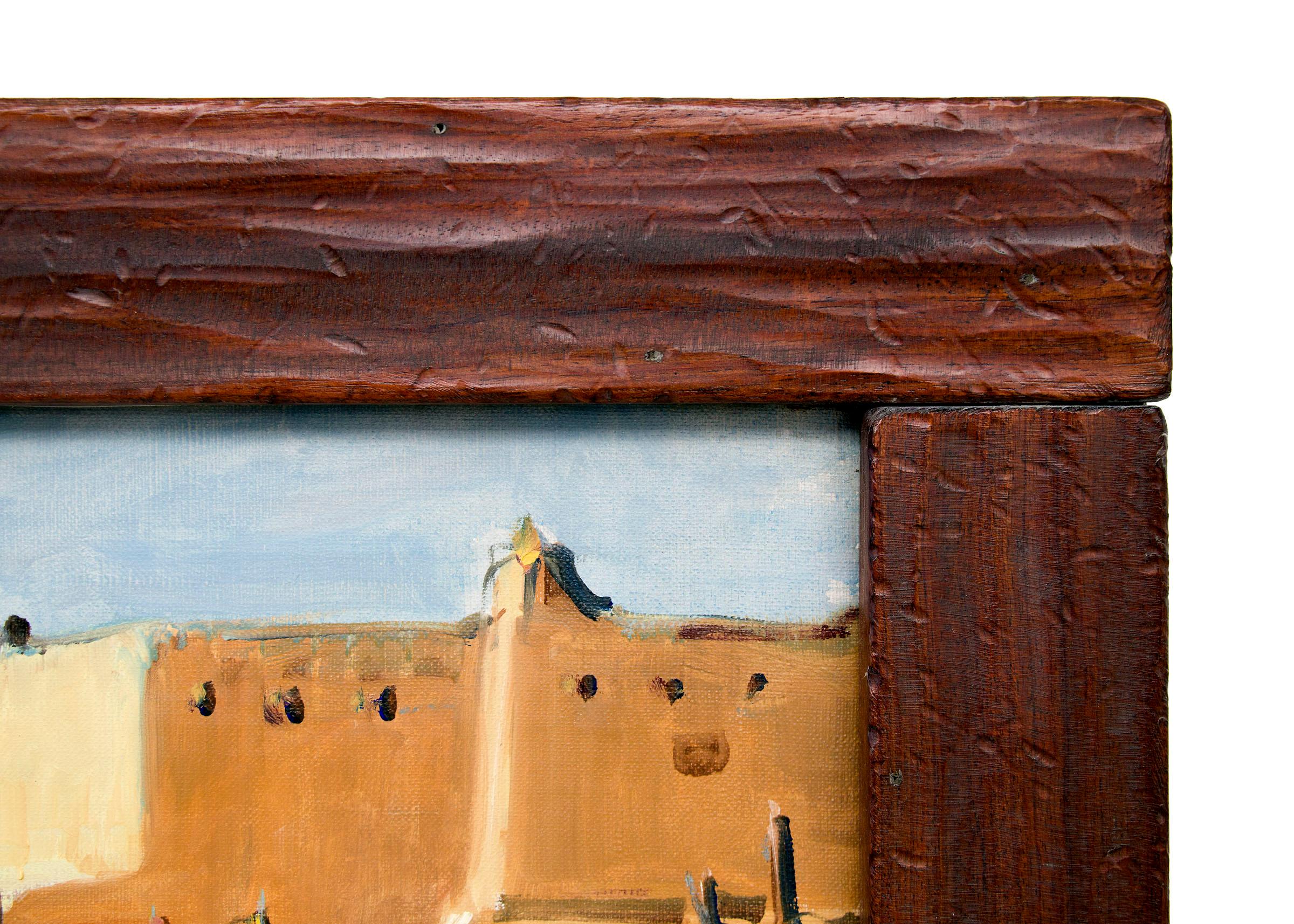 Original 20th century oil painting by Wolfgang Pogzeba (1936-1982) with Native American figures standing in bright blankets with adobe buildings in the background at Taos Pueblo, New Mexico.   Presented in a custom hardwood frame, outer dimensions