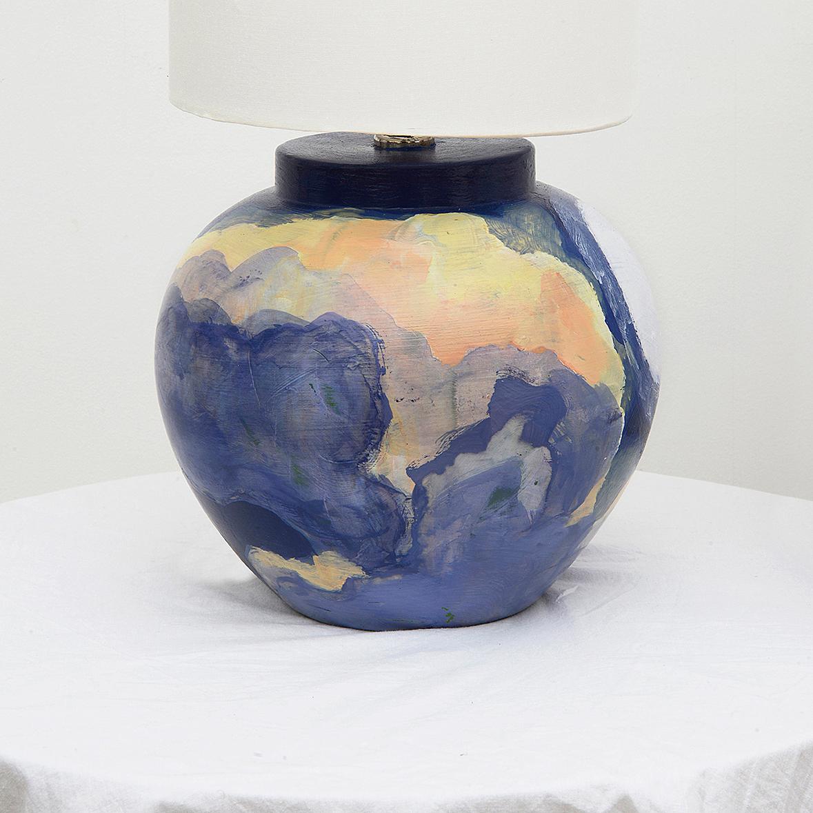 A unique pair of ceramic bedside lamps sourced from the archive at Portmeirion Village, North Wales, for the purpose of painting by hand. 

The original dark green finish has been refreshed and updated with a hand painted expressionist Sun and Moon