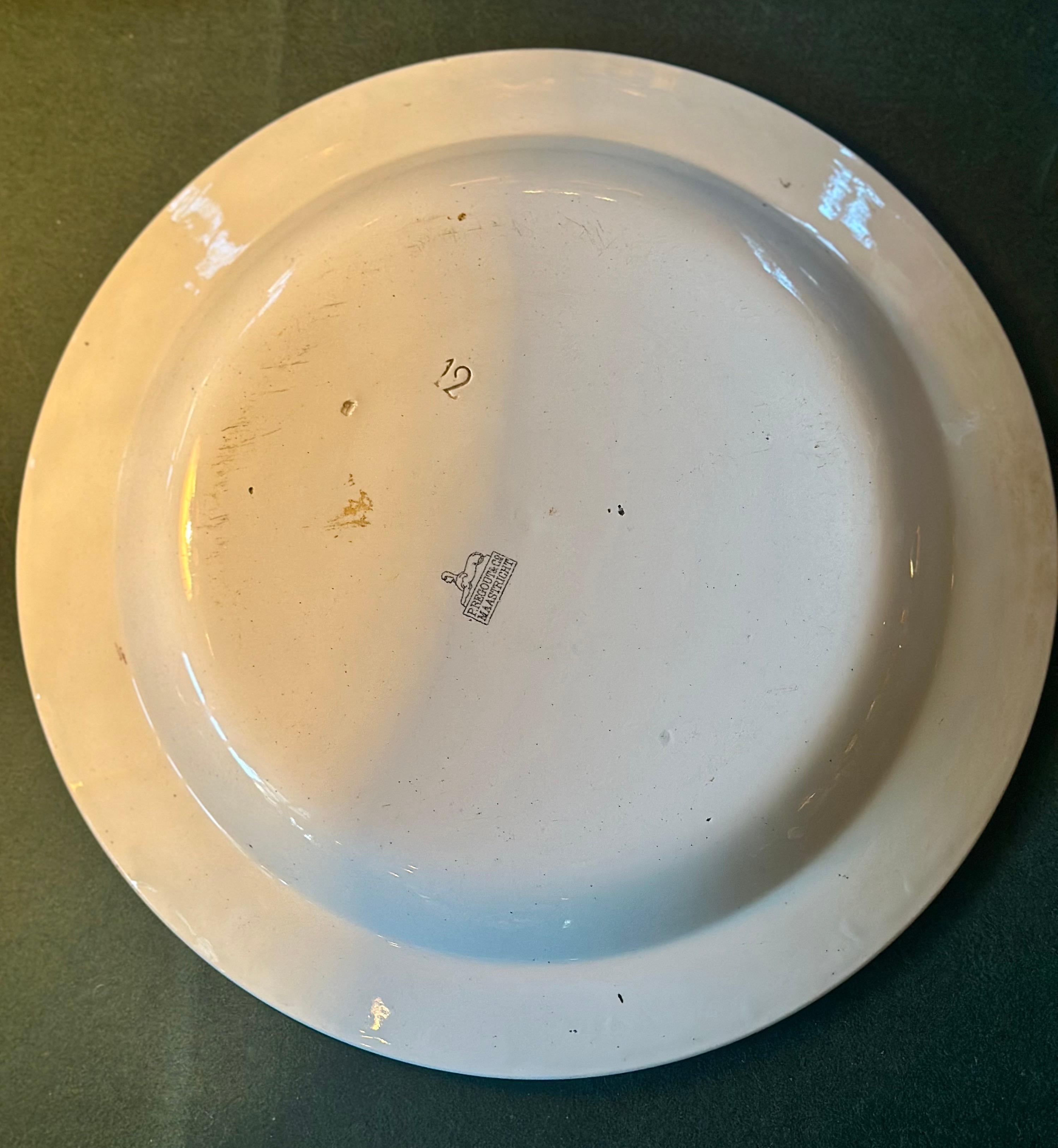 This large porcelain gaming plate, circa 1830, has the signature 