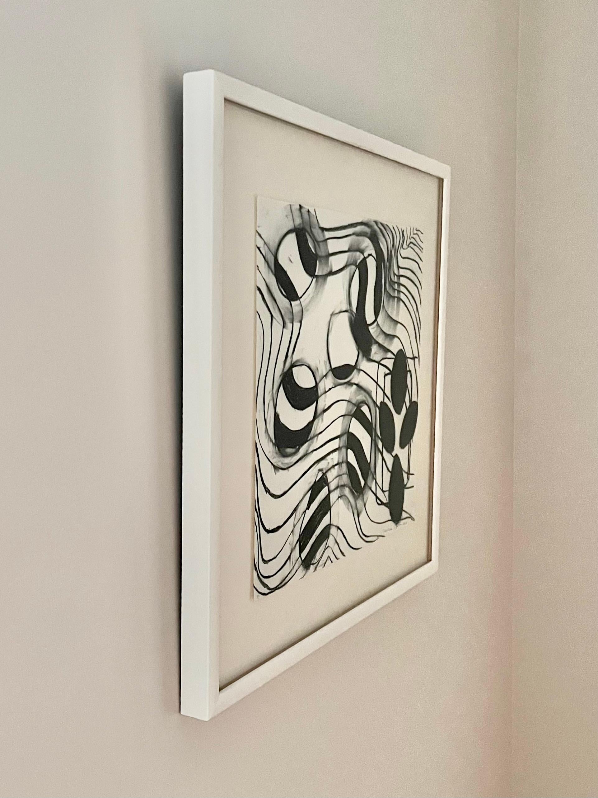 Framed abstract charcoal drawing on paper by artist Martha Lloyd.

About the artist:
Martha Anne Lloyd was born in Washington, D.C. in 1927. An avid artist, Lloyd completed a BFA degree at the American University in Washington, D.C. At age 63, she
