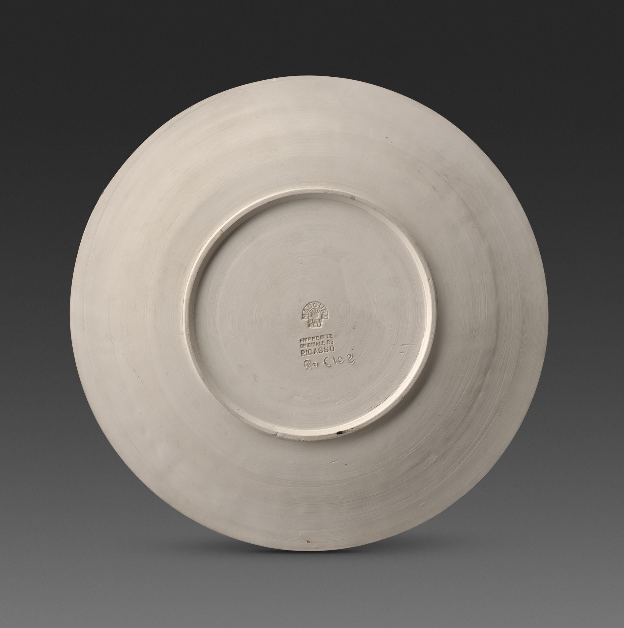 In the ceramic work Joie de Vivre (Joy of Living), Picasso employs the simple decorative motifs characteristic of his ceramics, creating a striking monochromatic piece. Using simple relief lines, the artist depicts joyful figures dancing in a