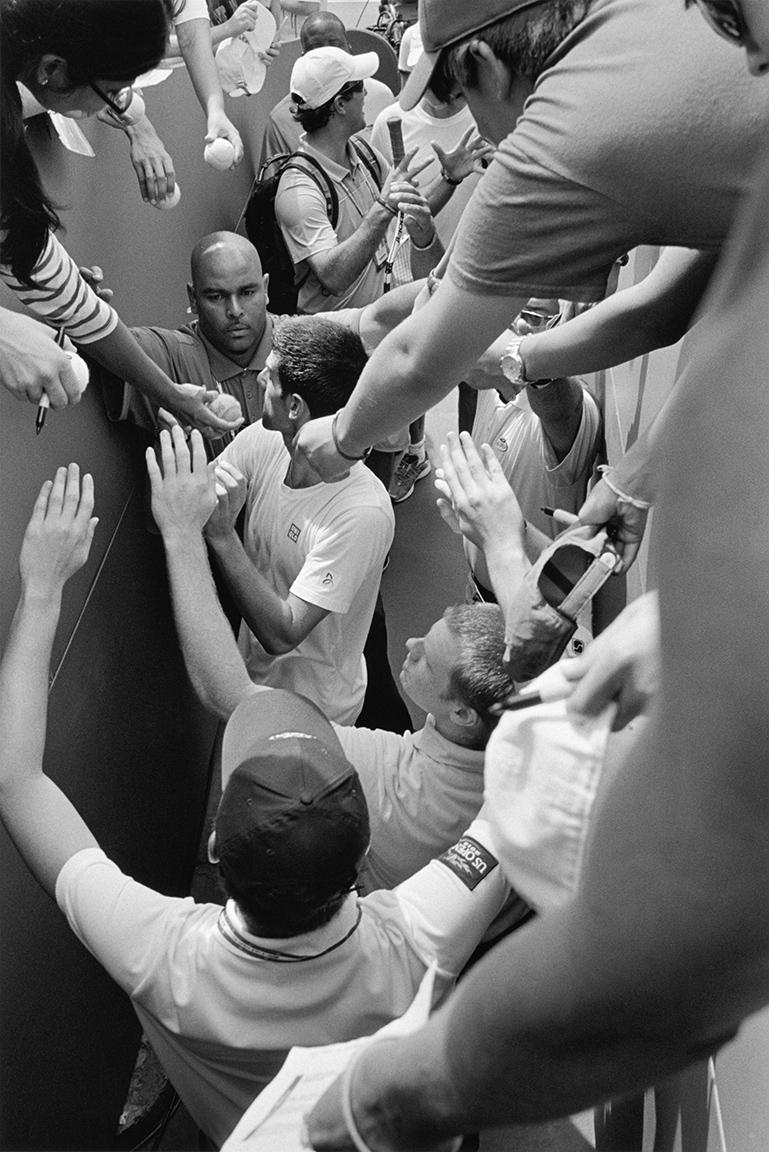 Stephan Würth Black and White Photograph - Novak Djokovic signing autographs, Queens, New York