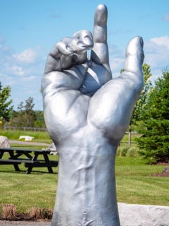 Ascension 3/5 - large, silver, hand, fiberglass and resin outdoor sculpture