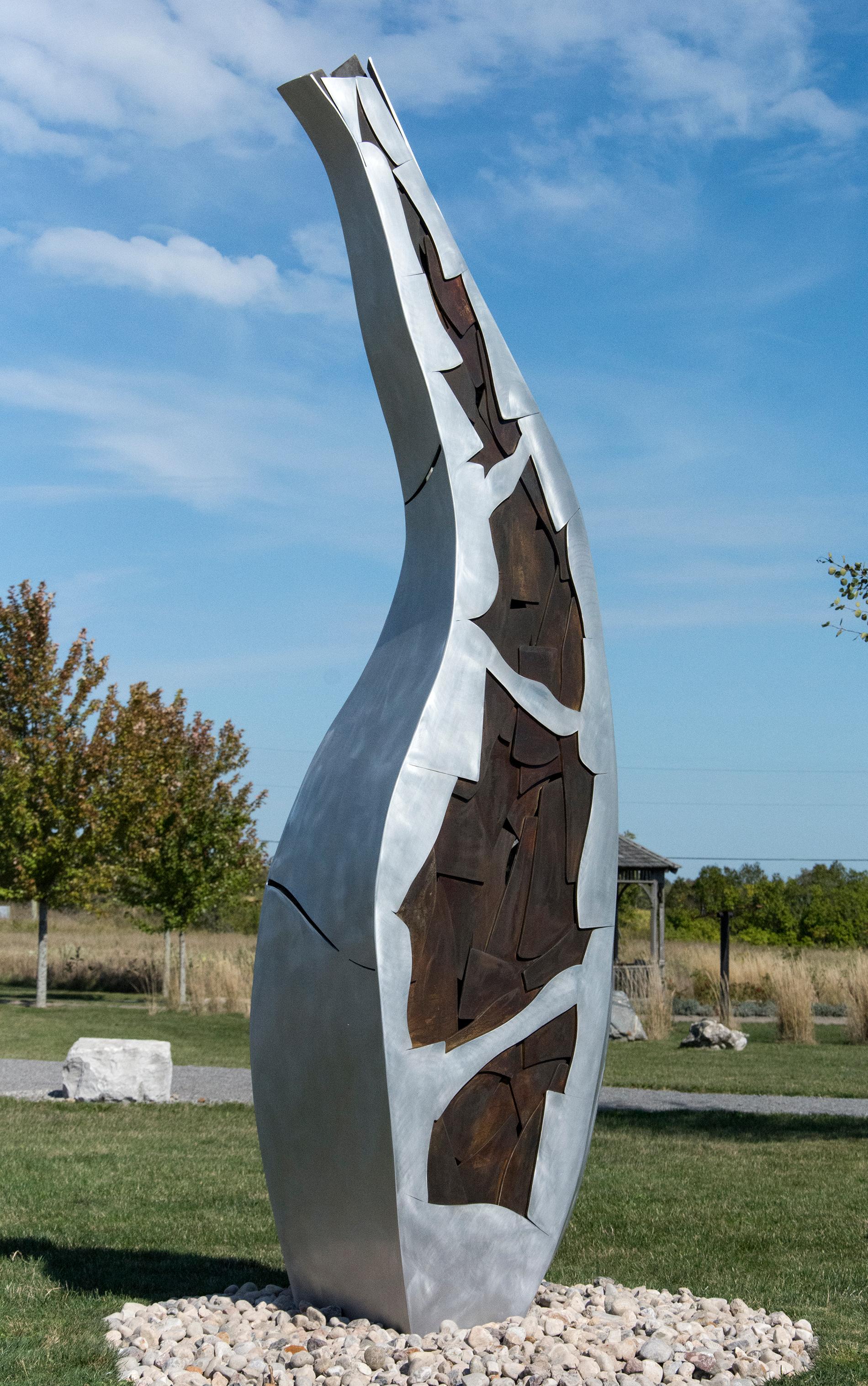 An organic shape rises from the ground and reaches for the sky in this finely crafted aluminum sculpture by Stephane Langlois.  

Stephane Langlois completed a bachelor's degree in psychology, in 2002, and a D.E.C in sculpture at the Maison des