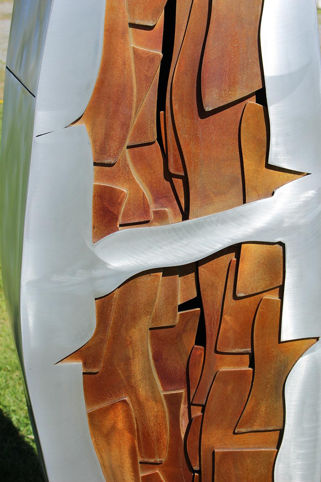 Two narrow leaf shapes rise from the ground and reach for the sky in this finely crafted aluminum sculpture by Stephane Langlois. The pieces sit about two feet apart and measure:  92 x 16 x 13 inches (110 lbs); and 106 x 17 x 19 inches (125 lbs).