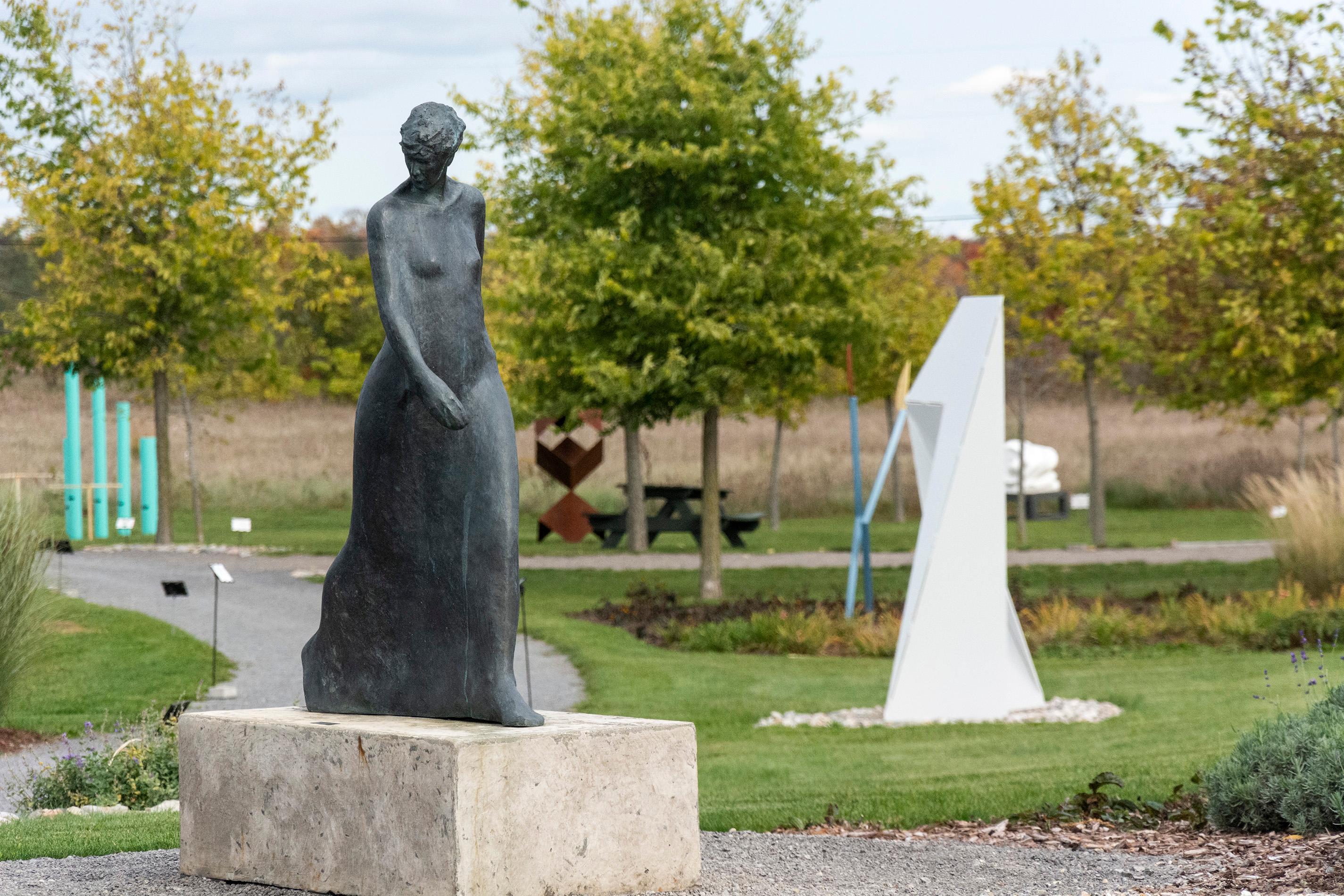 Using simplified shapes, artist Frances Semple reveals the emotive essence of movement in this bronze sculpture of a walking woman. At 45 inches high, the figure is about three-quarters life size. The sculpture is inscribed by the artist with her