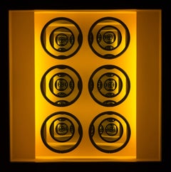 Eight - Illuminated concentrically layered circles in amber yellow