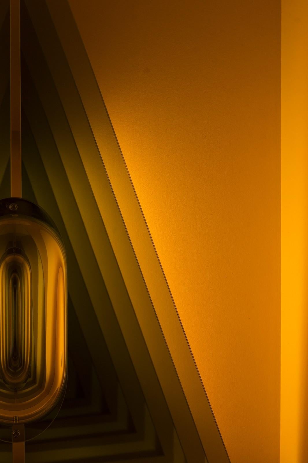 Acute Triangle - Illuminated geometric forms in amber yellow - Contemporary Mixed Media Art by Kenneth Emig
