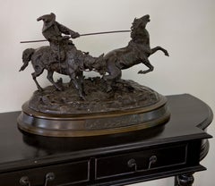 Bronze sculpture of a horse catching Russian farmer signed by Yevgueni Lanceray