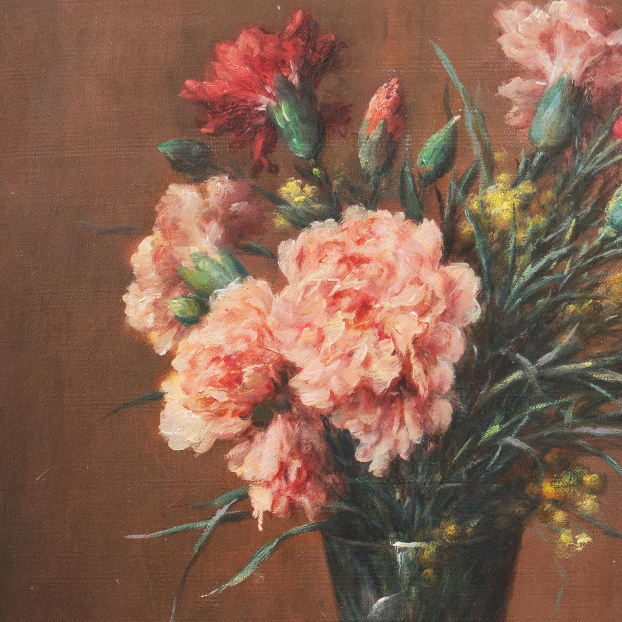 Signed lower right, 'E. Damois' for Ernest Emile Damois (French, 19/20th century) and painted circa 1915. 
Framed dimensions: 20 x 26 inches.

A  closely-observed and delicately realized, oil still-life of pink and red carnations shown informally