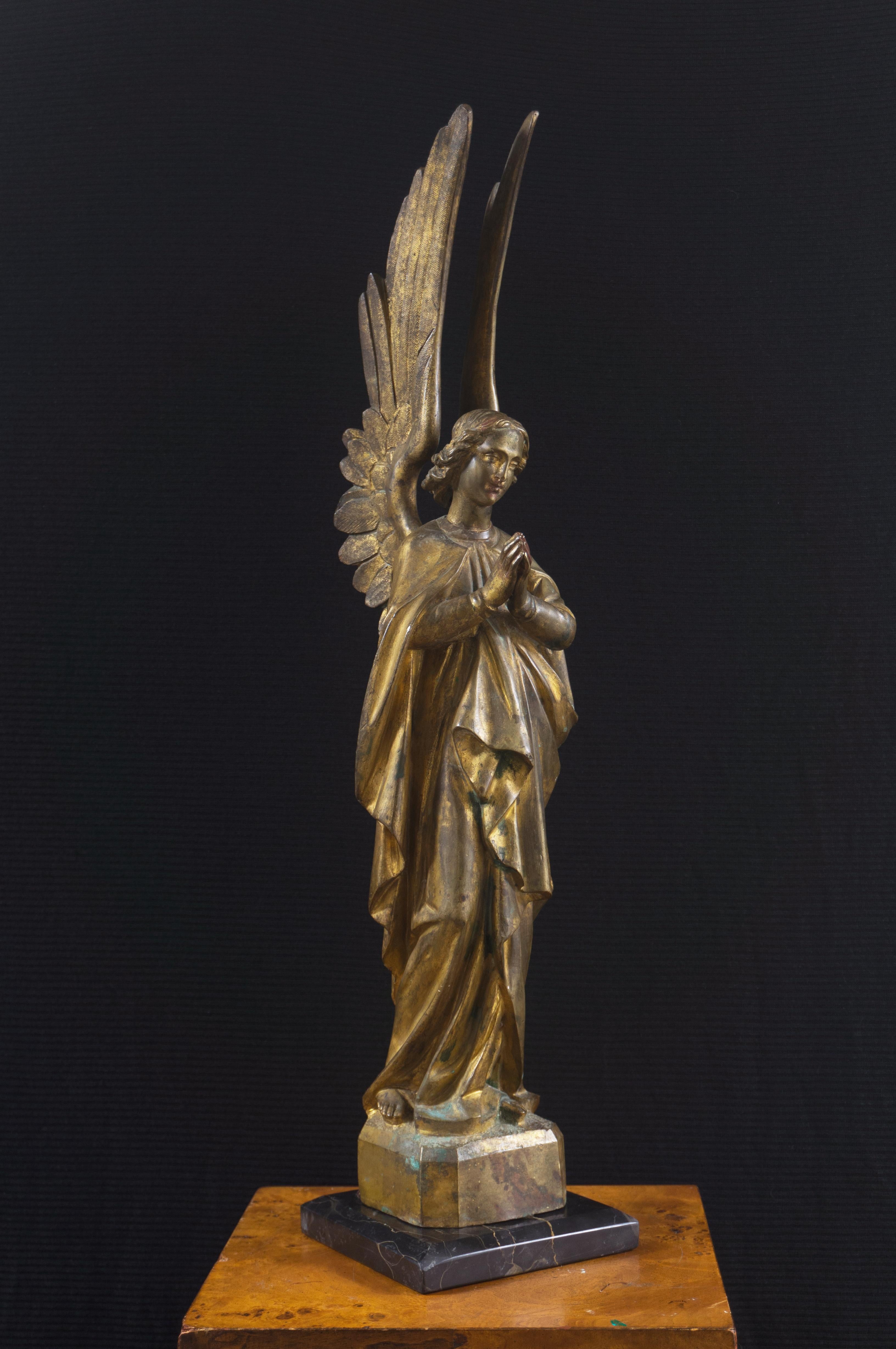 A substantial and finely cast, late 19th-century French School, figural bronze of a winged and robed Archangel, the spiritual being shown standing with hands gently pressed together and wearing an expression of ineffable sweetness. This large and