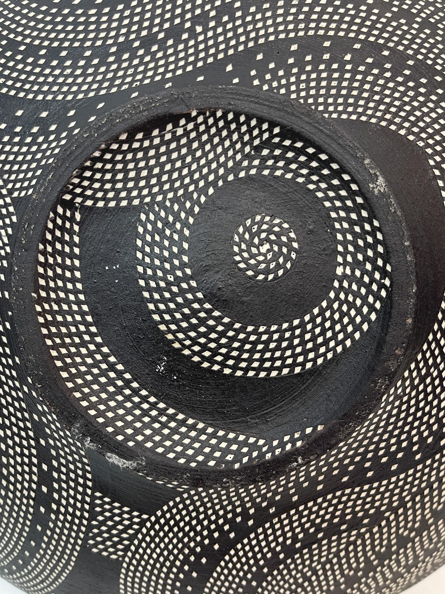 KITAMURA JUNKO (b. 1956)
Cone Vase, c. 1993
Stoneware, black slip, inlay, with signed tomobako
4.5 x 10 inches 
With artist signed tomobako

Kitamura Junko studied with Kondo Yutaka (1932-1983) and Sodeisha Founder Suzuki Osamu (1926 - 2001) at the