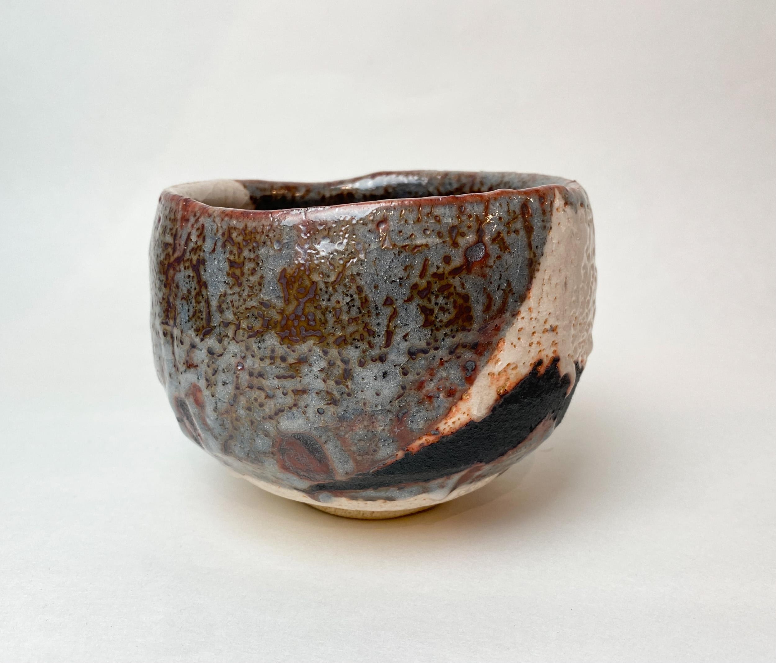 WAKAO TOSHISADA (b. 1933)
Tea Bowl with nezumi-shino glaze, 1998
With signed tomobako
Stoneware
3.625 x 5 x 5 inches 
With artist signed tomobako

Born in Tajimi. After graduating from junior high school, he worked at a ceramics factory while