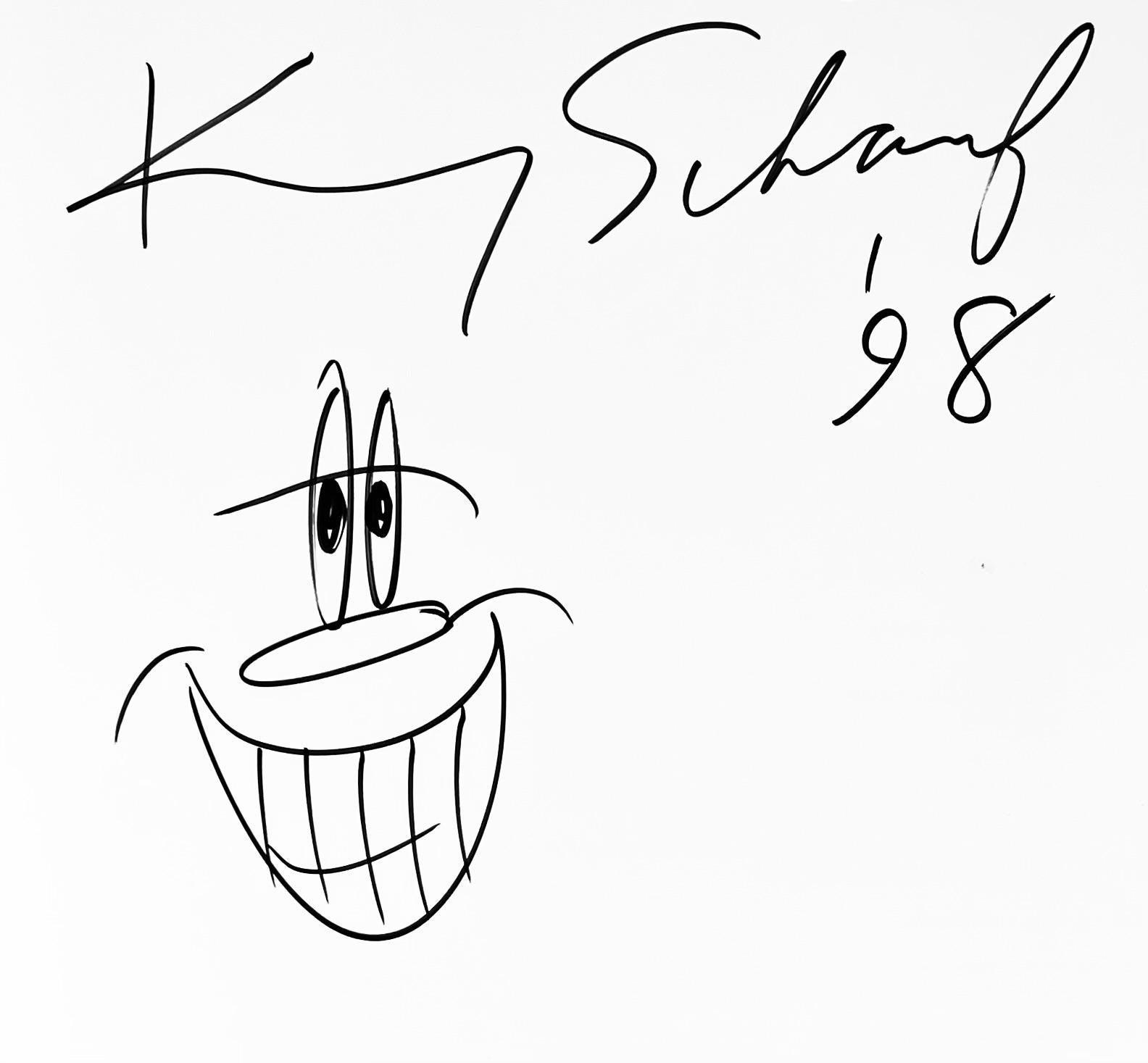 Kenny Scharf drawing 1998 (book drawing):
1990's Jean-Michel Basquiat, Keith Haring, Kenny Scharf exhibition catalogue featuring a signed & inscribed Kenny Scharf drawing. Further background: 

In 1997, parallel to the Keith Haring retrospective at