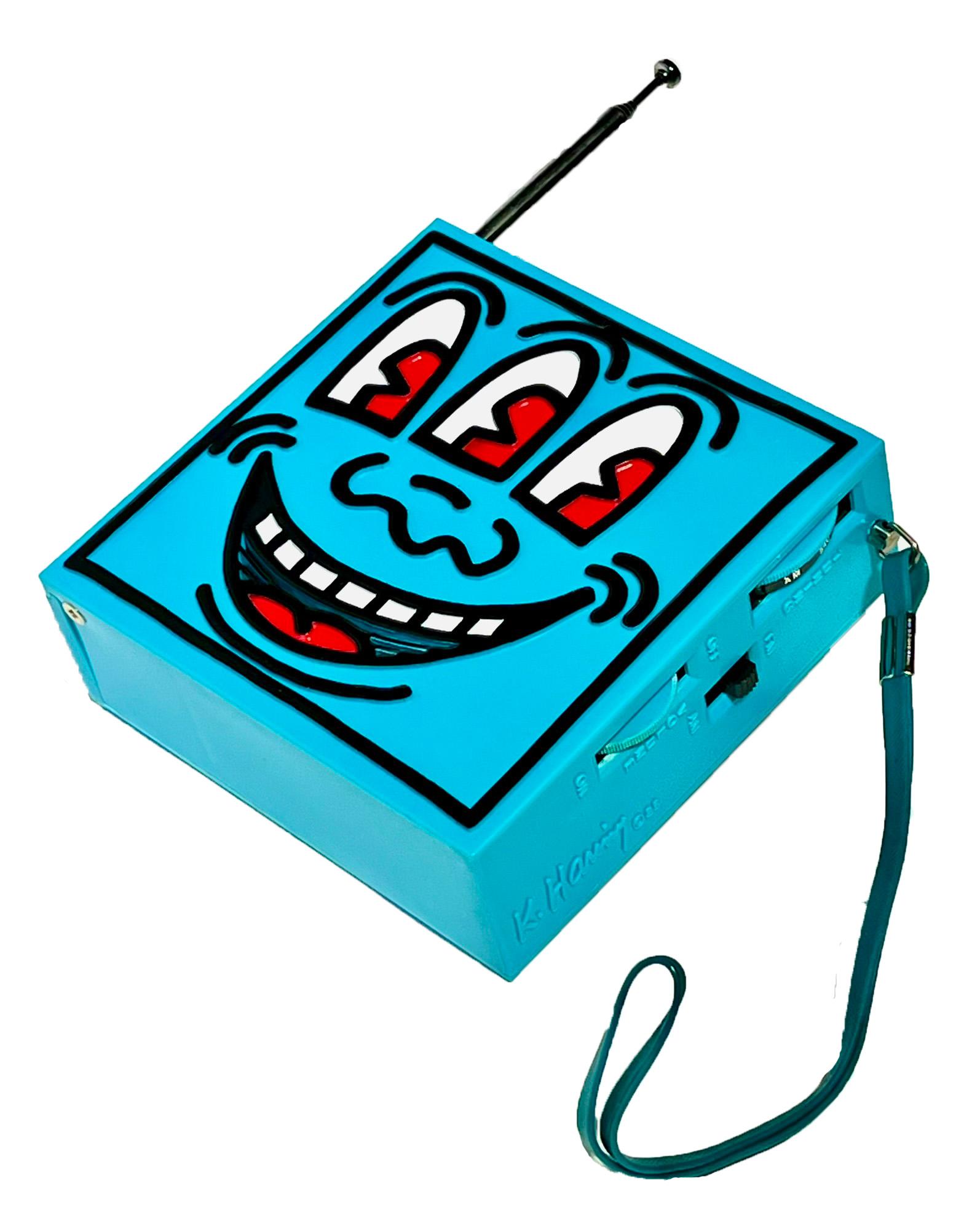 Keith Haring Pop Shop 1986:
A very well preserved Keith Haring Pop Shop radio accompanied by its original packaging. Sold at the Pop Shop in New York c. 1985. Features a bold Keith Haring printed signature on box and a molded signature on radio.