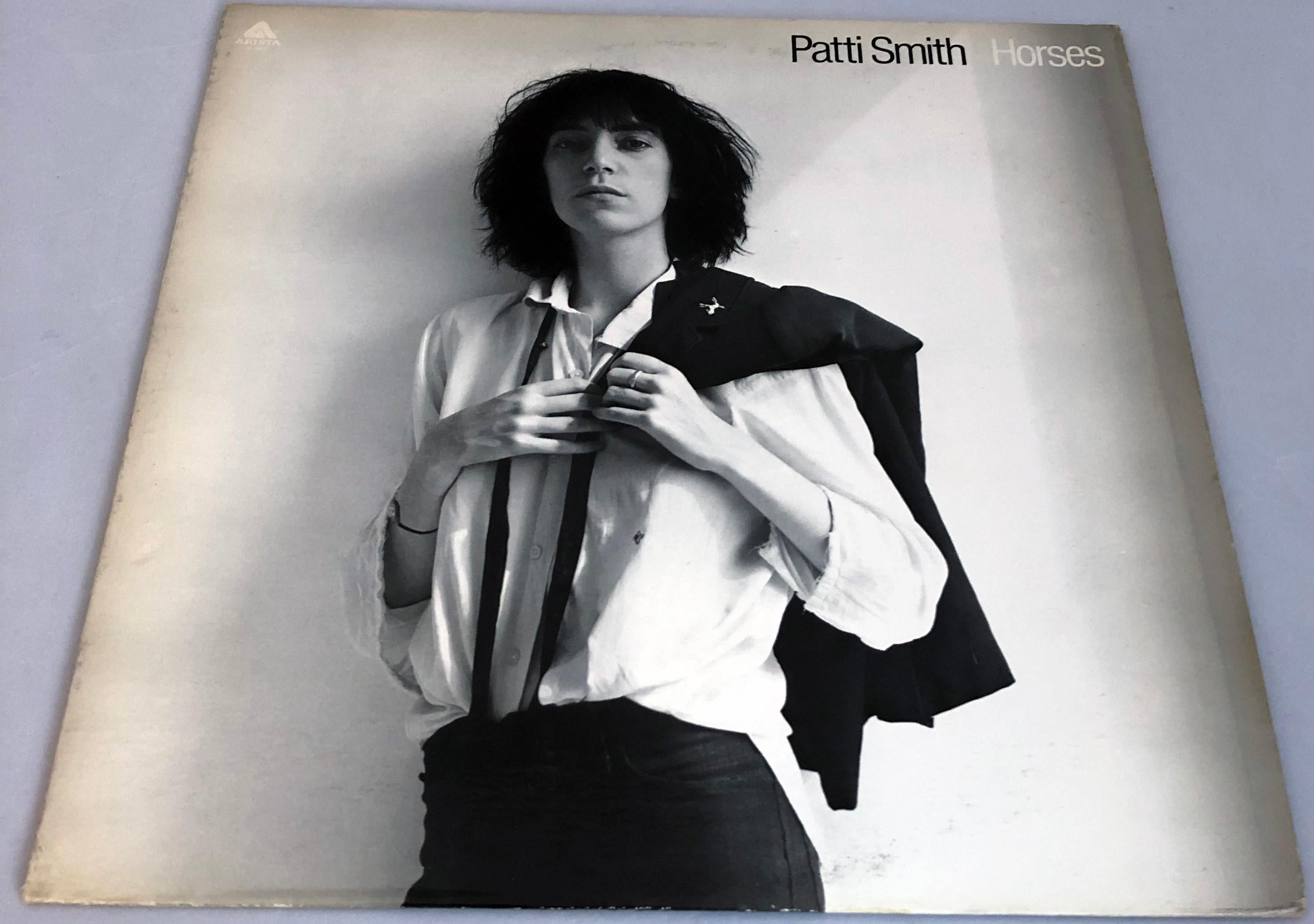 Patti Smith Horses Vinyl Record Album, 
Original 1975 US 1st Pressing featuring original photography by Robert Mapplethorpe. Includes original record in near mint condition. 

Produced by John Cale
Cover: Very condition with the exception of some