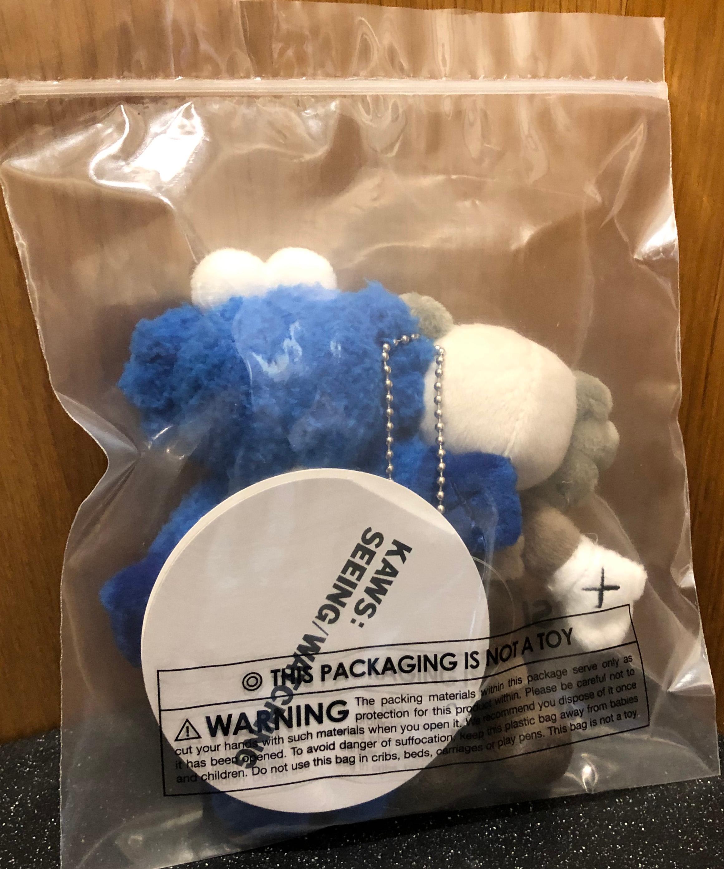 KAWS Seeing/Watching Plush Keychain 2018
New in its original packaging. Released in conjunction with the installation of the KAWS Seeing/Watching sculpture in Hunan, China. The plush figurines feature the well known Companion and BFF arm-in-arm, and