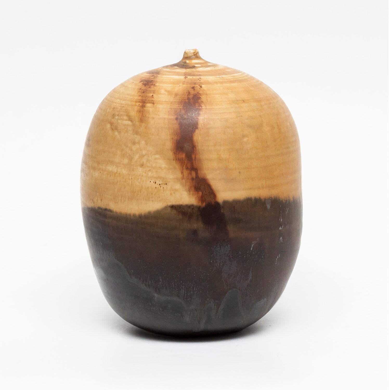 Moonpot (INV-NP2434)
Rare
porcelain and glaze
7 x 5.5 x 5.5”
signed
date unknown

Toshiko Takaezu (June 17, 1922 – March 9, 2011) was an American ceramic artist and painter. She was born to Japanese immigrant parents in Pepeekeo, Hawaii, in 1922.