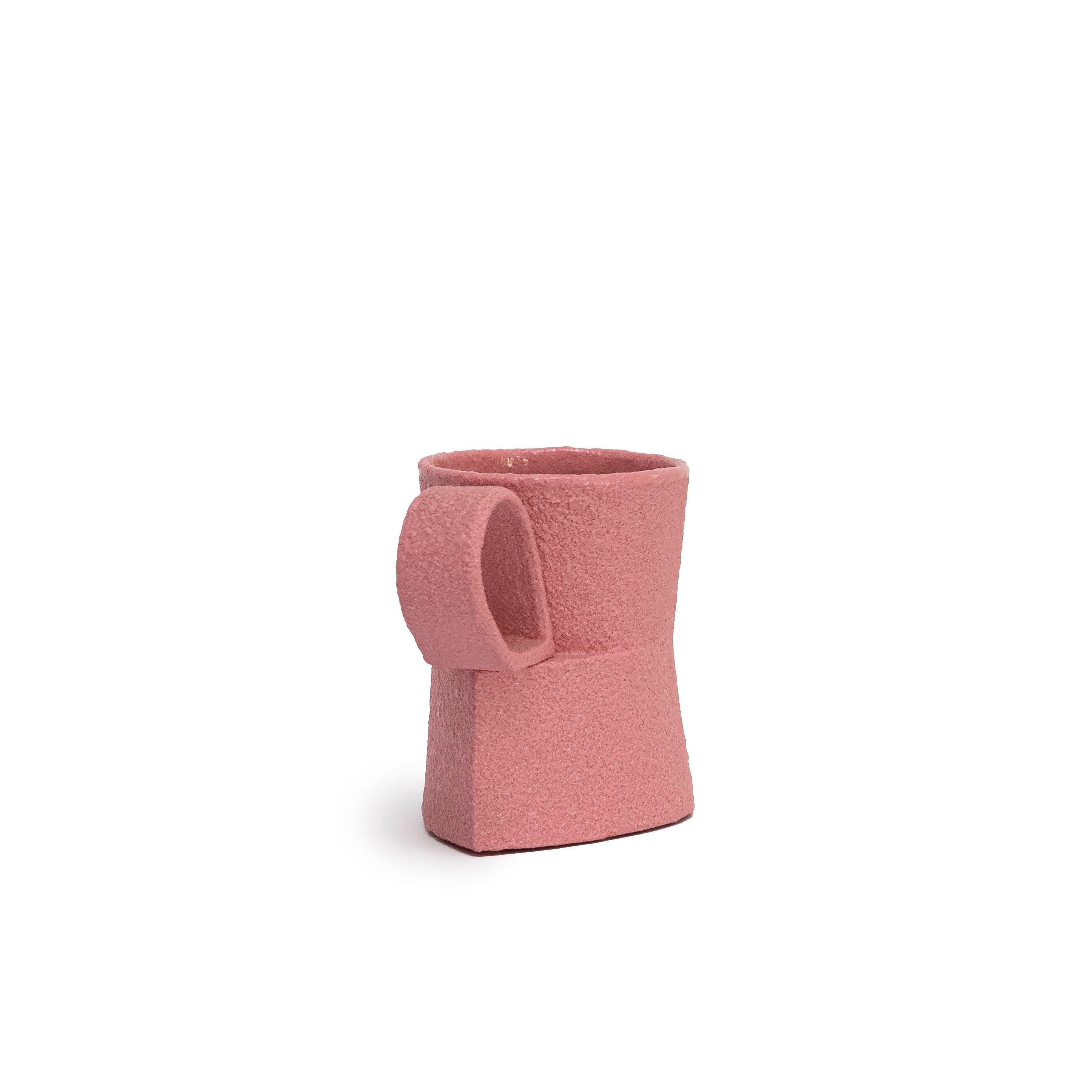 Pink Cadillac Cup 
pink porcelain and glaze
2.5 x 3.5 x 2”
1988
perfect condition

Ron Nagle is one of the most important sculptors in the United States.  He work is highly collected and included in museum collections such as Shigaraki Museum,