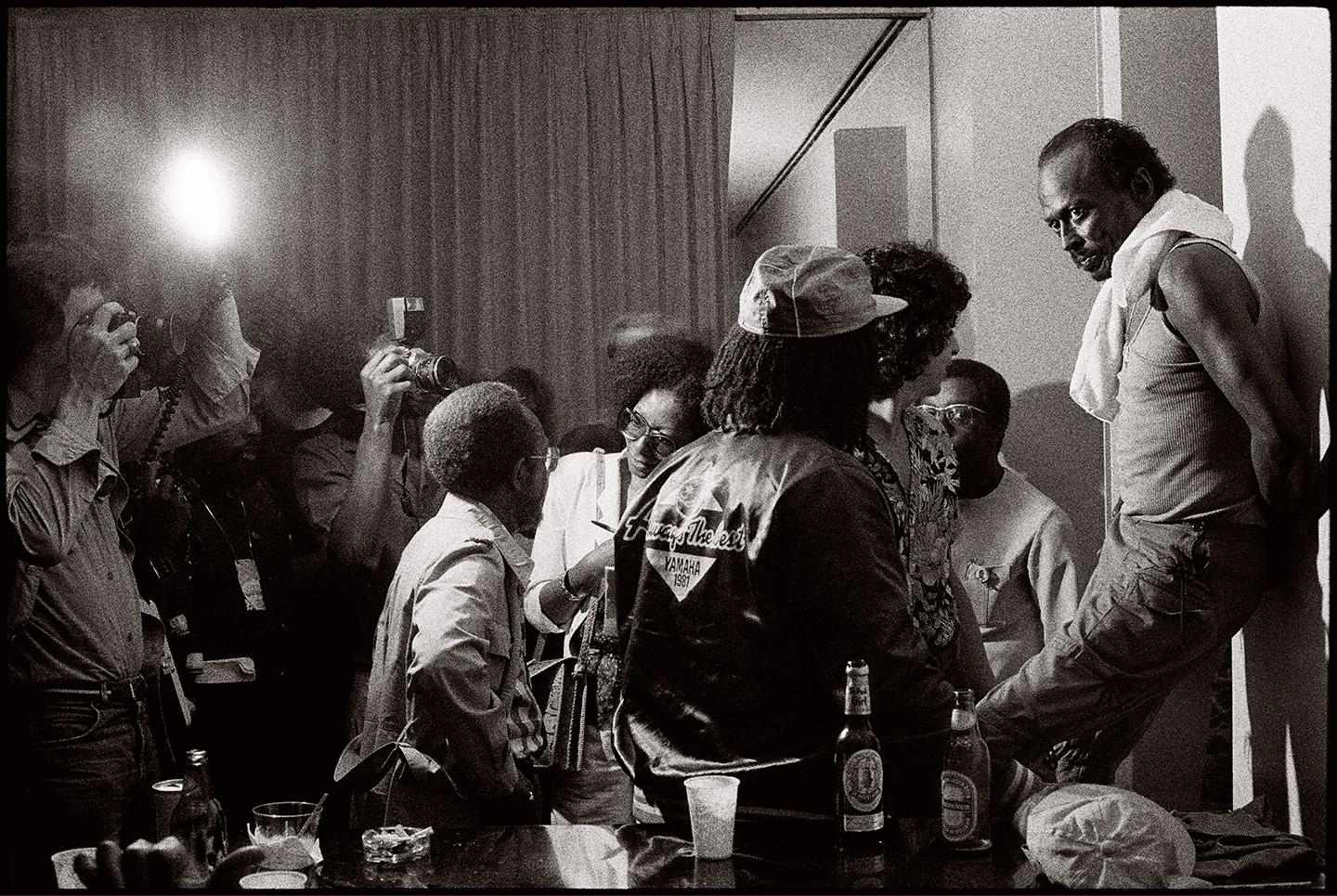 'Miles in the Green Room' by American photographer Frank Stewart, 1981. Pigment print, 28 x 40 inches. Edition 5 of 15, Recent Print, signed lower right corner. This photograph features Miles Davis at Avery Fisher Hall during the Miles Davis