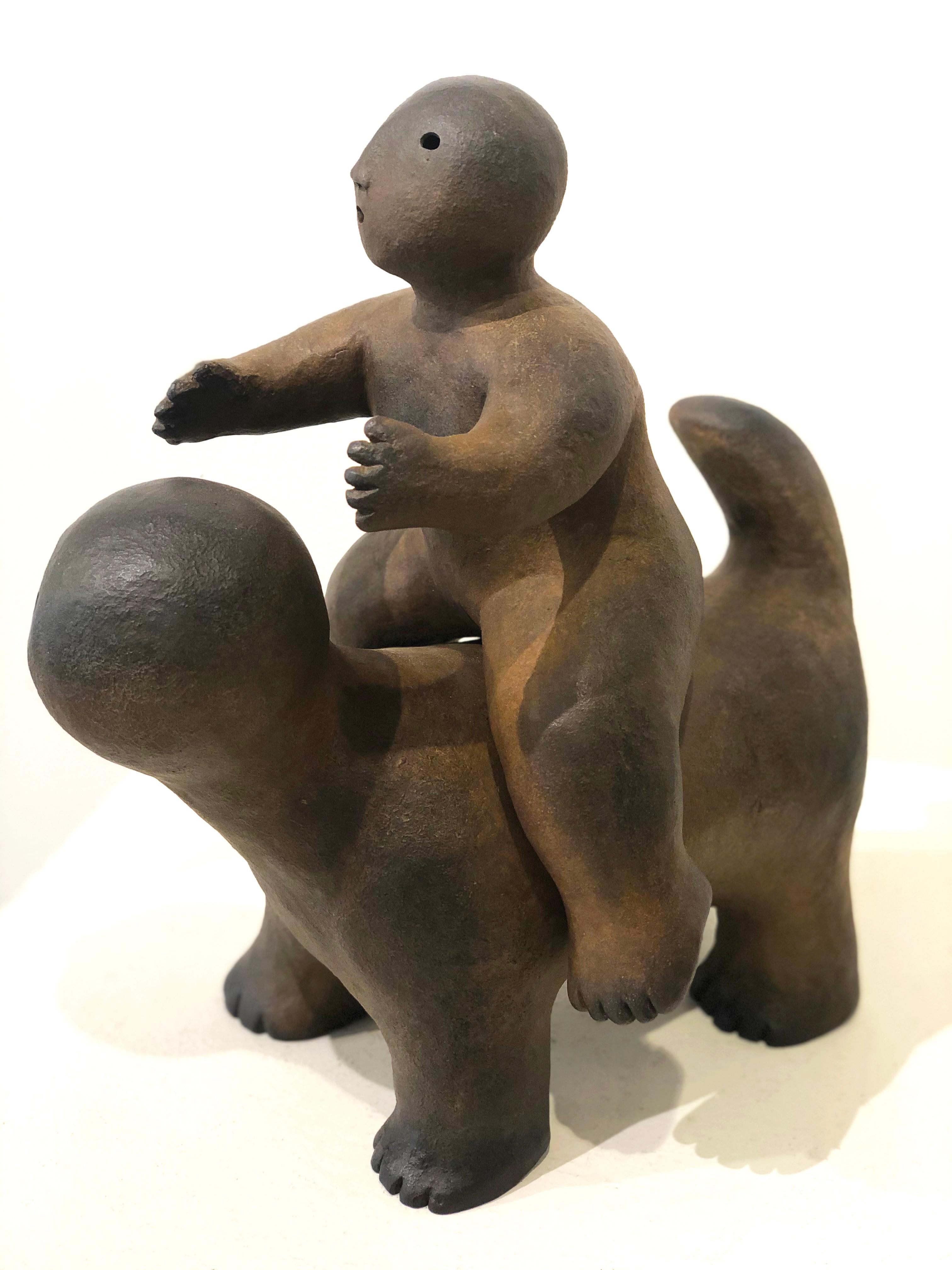 'Animal With Rider' 2019 by Connecticut artist, Joy Brown. Bronze, 13 x 11 x 9.5 in. Influenced by Japanese aesthetics and using their traditional pottery methods, Brown creates child-like, anthropomorphous figurative sculptures in clay and bronze. 
