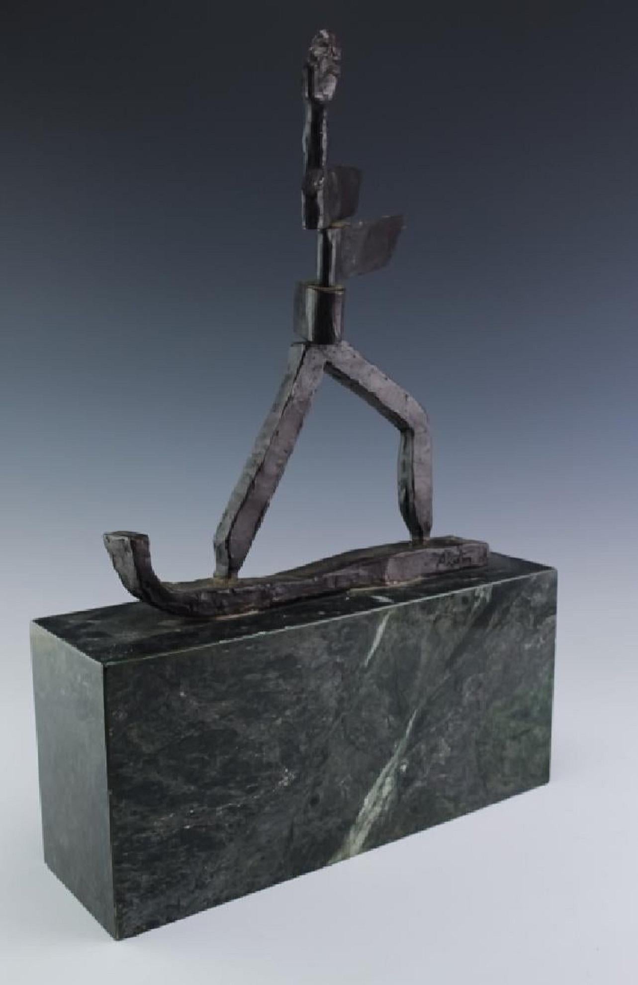Vintage stylized figural sculpture by J James  Akston (1898-1983 Poland/New York/Florida) Crafted of cast bronze with a rich dark brown patina. A sports figure, depicting a snow skiing or water surfing figure in a Mid Century Modern Brutalist style.