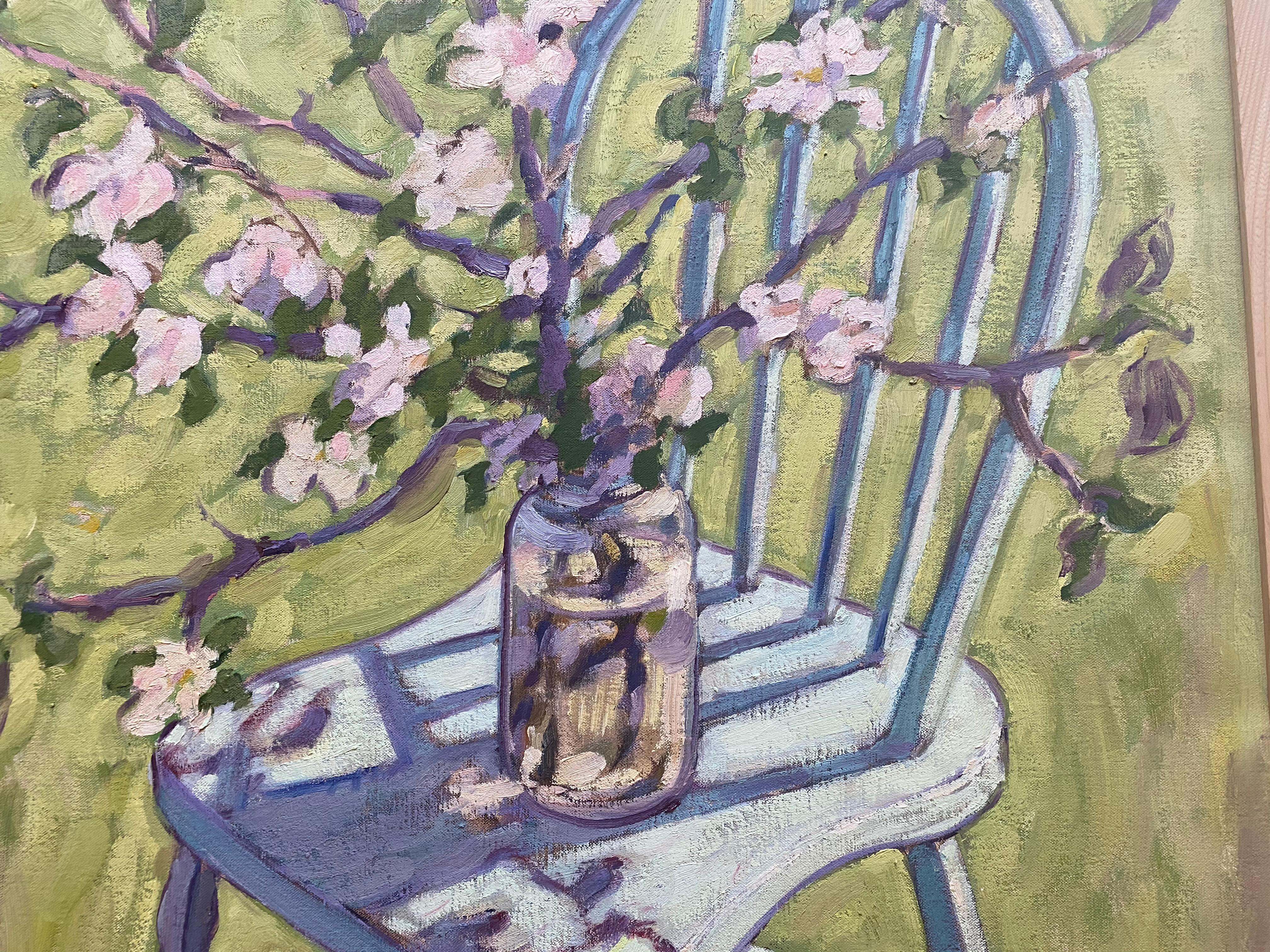 Painted from life in the artist's backyard, a grouping of branches bloom apple blossoms, gathered in a large mason jar, and propped up on a traditional wood chair. A canvas covered in green hues.  The effects of light and shadow cast colorful
