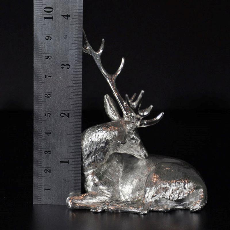 A finely modelled sterling silver lying stag sculpture by Hancocks, Contemporary
8.4cm long x 9.6cm high
160.00gms.