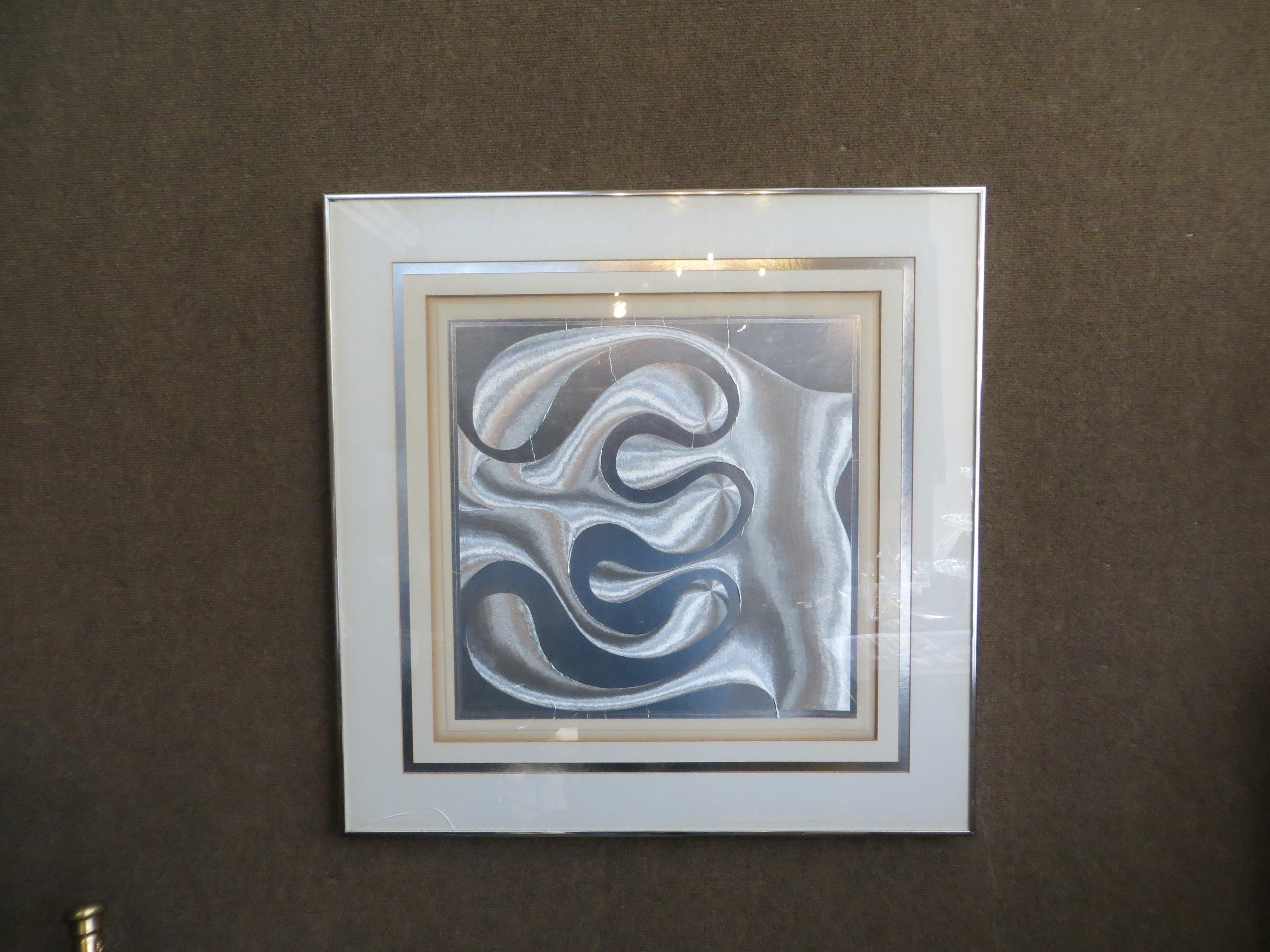 Patrick Dupré (1945) is a French visual artist and well known for his silver print reliefs. A beautiful Op-Art (Optical Art) with a swirl effect. It is the way you look at it and then you see the relief change by the daylight that falls on