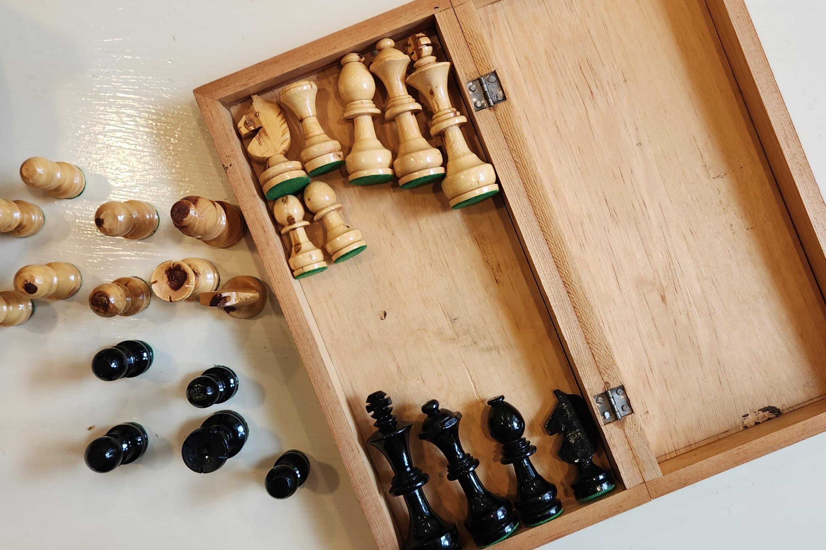 This hand carved wooden chess set from the 1960's is a wonderful display of American craftsmanship. The attention to detail of the unnamed craftsperson can be seen in each of the beautifully cared chess pieces. The board of this set can be folded