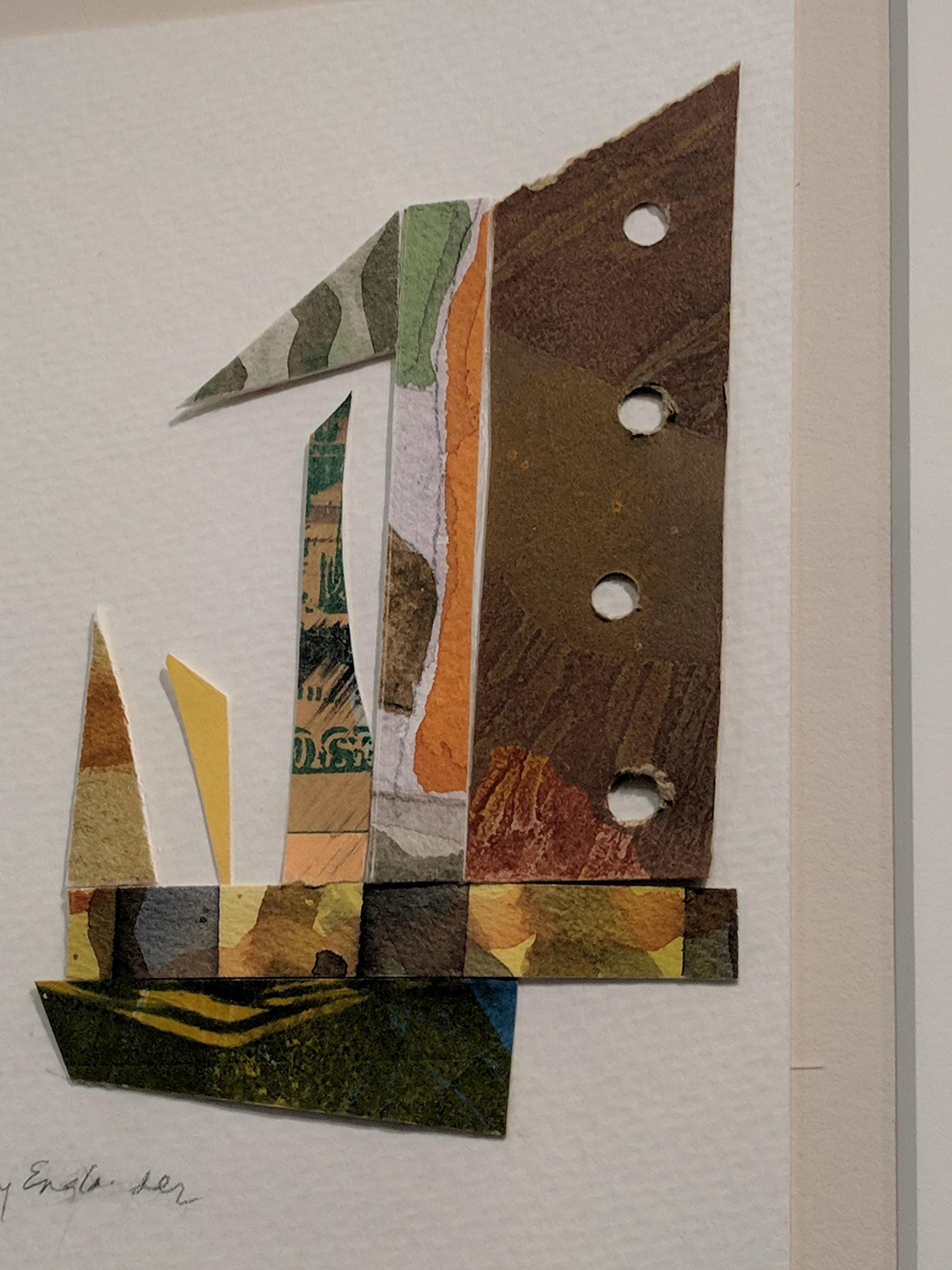 This mixed media collage is made of fragments from earlier works by the artist. The collage is set on watercolor paper, which floats within a mat centered in the frame. Green, yellow, and orange colors predominate, but the overall impression is of