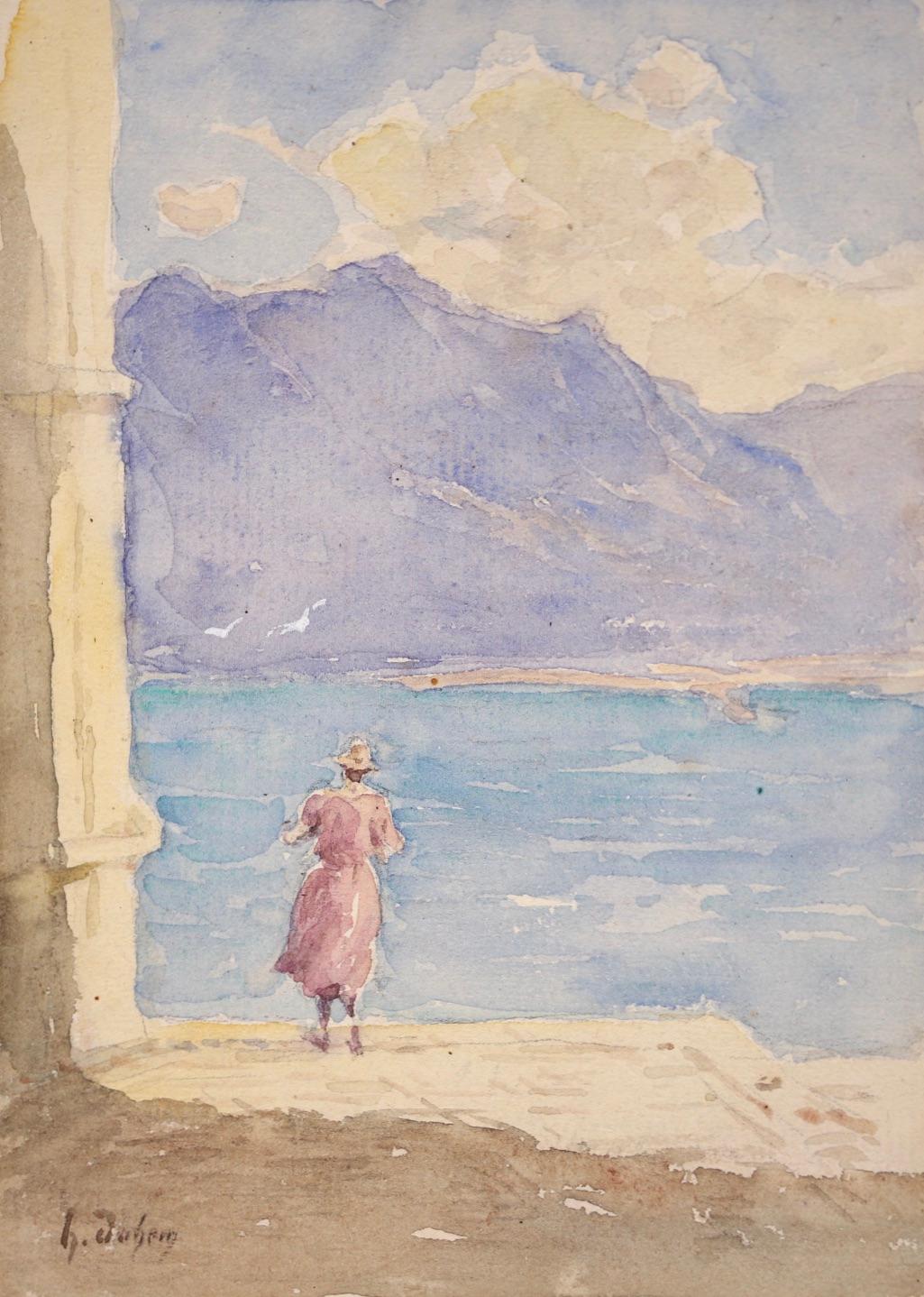 A beautiful and delicate watercolour on paper circa 1920 by French impressionist painter Henri Duhem. The work depicts a woman in a pink dress and sun hat looking out of blue water of Lac Leman (Lake Geneva) in Switzerland and the mountain