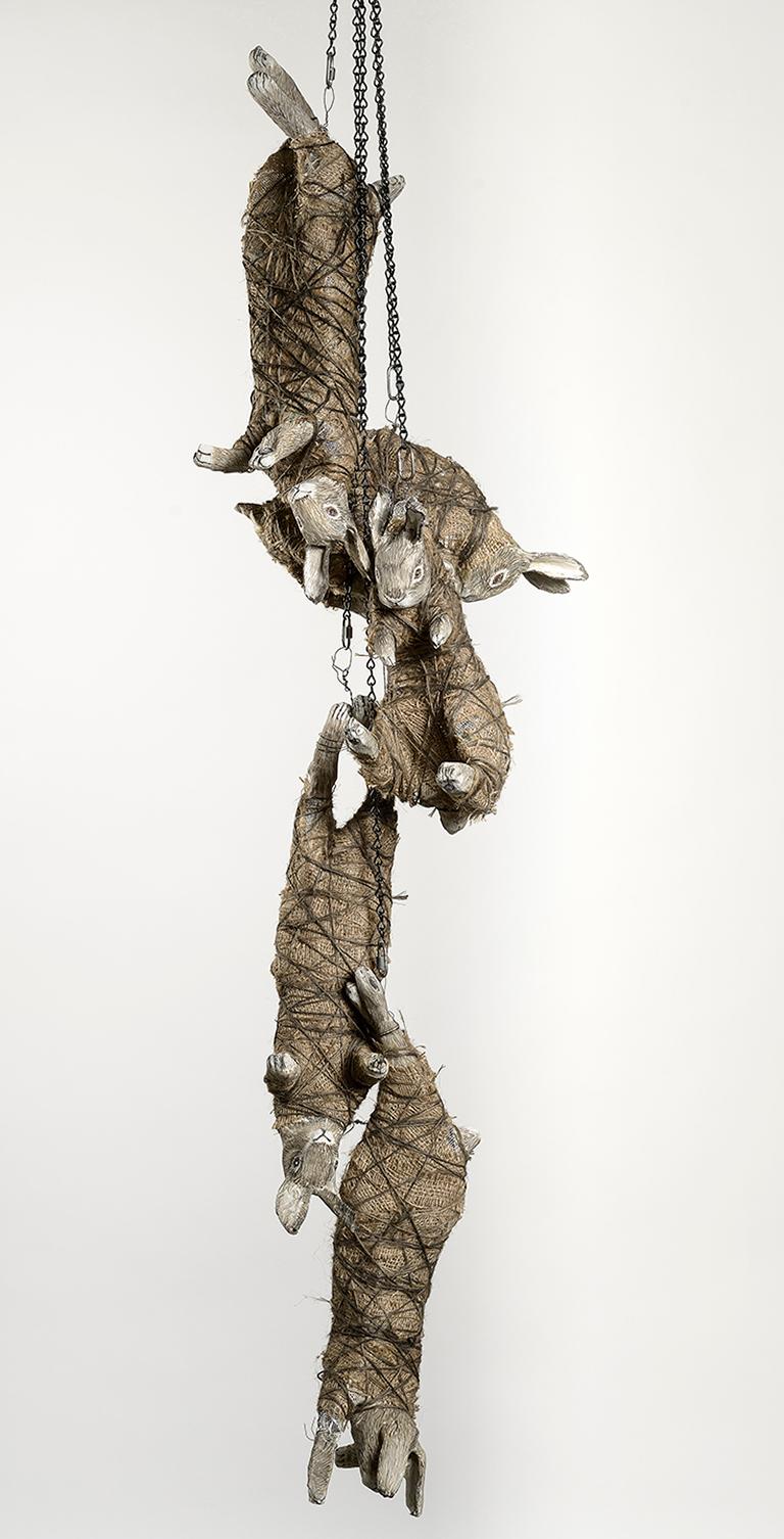 Rabbits chained together, earth tone sculpture: 'The Moon Glazing Hare'