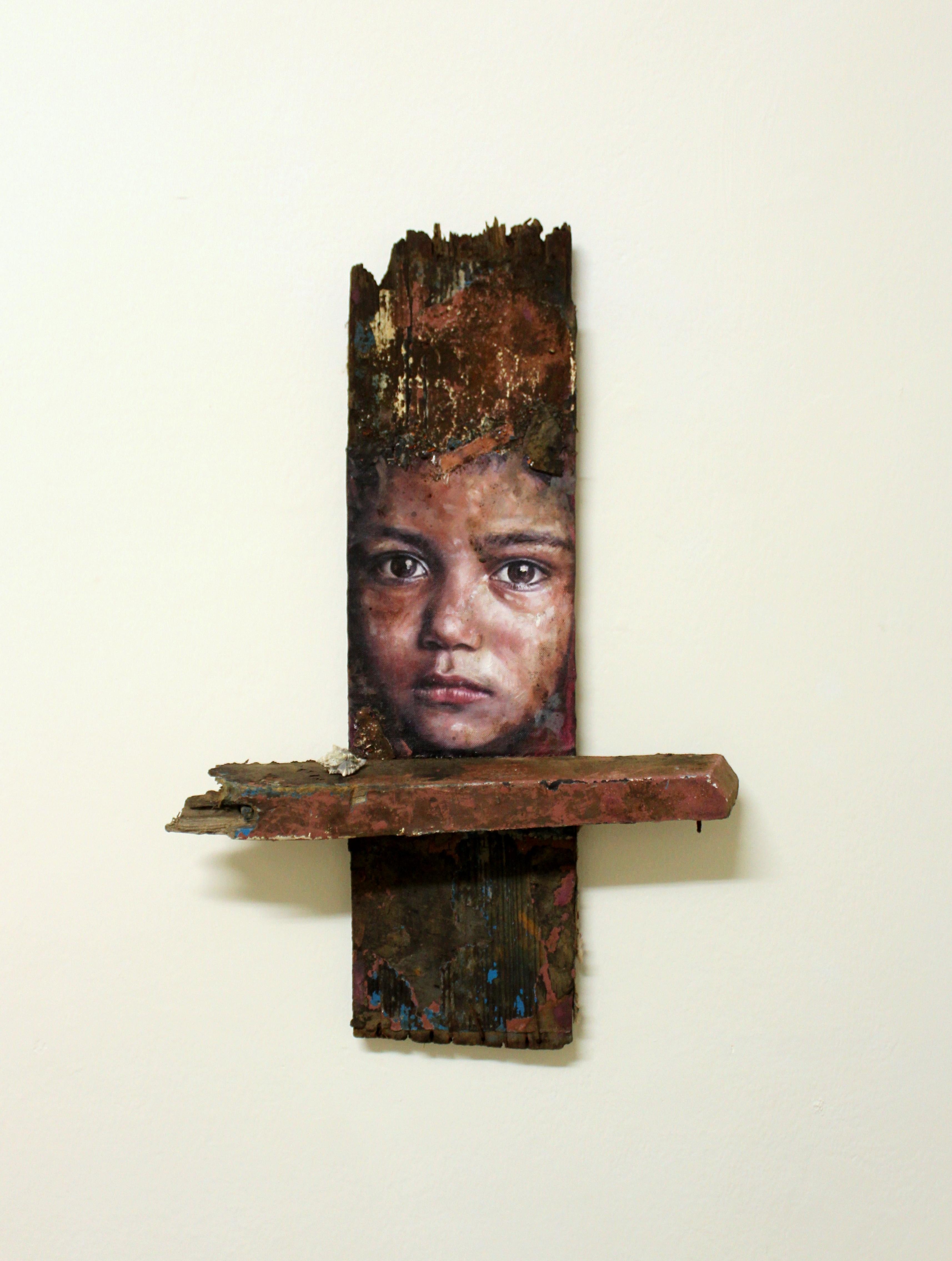 Portrait of young boy on driftwood: 'Nepal (Body and Soul)'