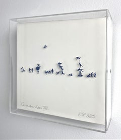 Blue hand cut figures pinned on paper framed in acrylic box. 3D. In stock 